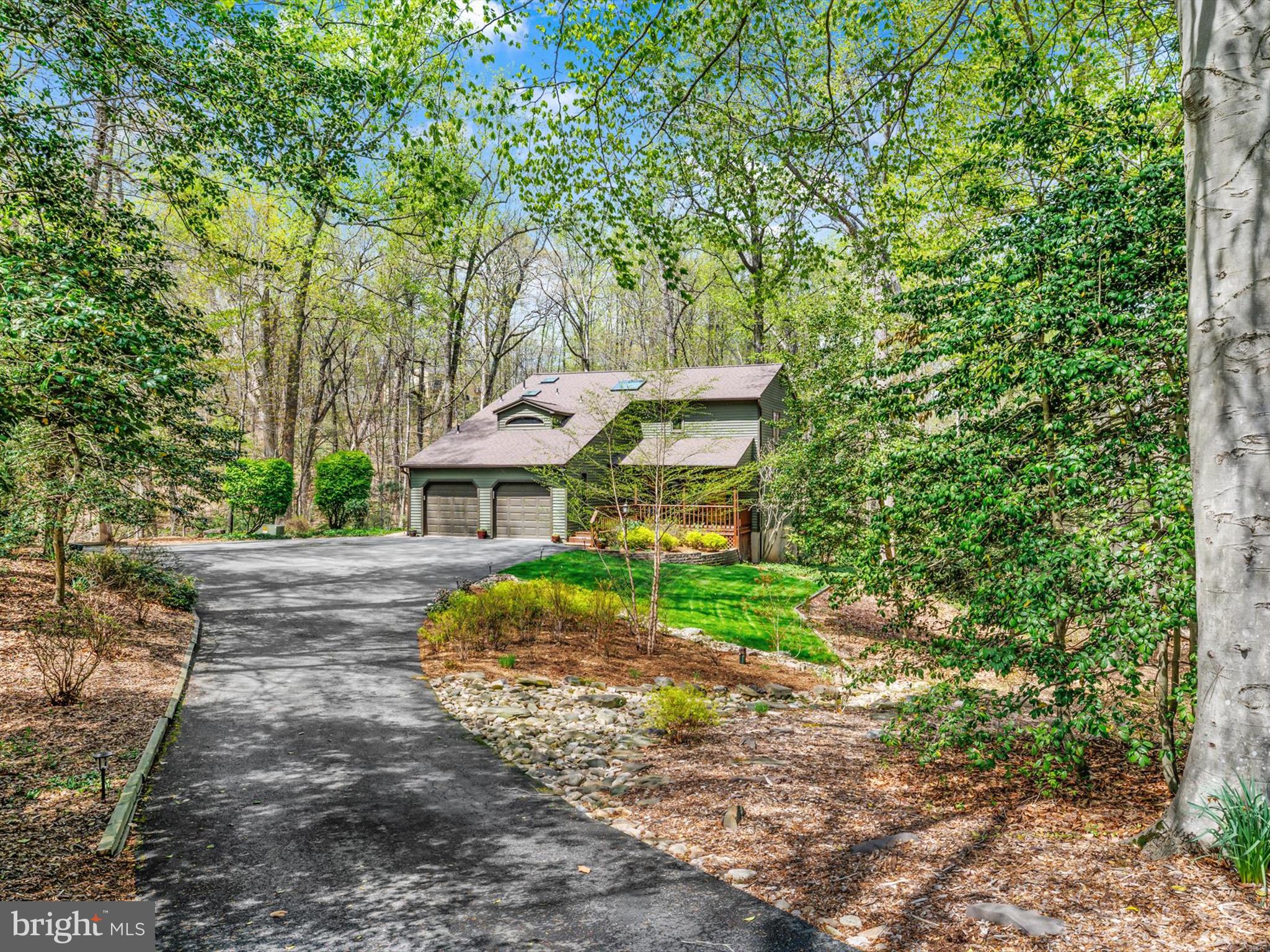 SALTWORKS ON SEVERN! Tucked away on 2.35 wooded acres, this stunning Contemporary offers privacy and serenity — yet you're just minutes from shops, restaurants, and major commuter routes. Inside, enjoy an open floor plan, a remodeled kitchen and baths, and freshly painted interiors.
Double doors off the dining area open to a screened porch, seamlessly blending indoor and outdoor living. The full-length rear deck is perfect for relaxing, entertaining, or stargazing.
Upstairs features two bedrooms, a full bath, and a spacious primary suite with a walk-in closet and custom organizer system. You’ll love the walk-in attic storage — a smart and convenient bonus.
The finished lower level offers a rec room, additional bedroom, and full bath, making it ideal for guests or a home office.
This fabulous home truly has it all—I can't wait for you to see it!