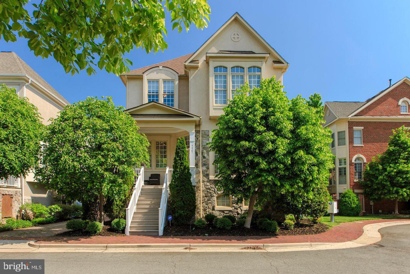 Welcome to this sun-filled and rarely available WYTHE model single-family home, ideally situated on a premium corner lot with beautiful views overlooking the neighborhood park. This meticulously maintained residence offers more than 3,300 square feet of thoughtfully designed living space across three fully finished levels, featuring five bedrooms and three and a half baths.
From the moment you enter, you’ll notice the abundant natural light and the warm, inviting atmosphere. The main level showcases elegant living and dining rooms, along with hardwood floors and custom paint that enhance the home’s sophisticated charm. The spacious kitchen is a chef’s dream, complete with maple cabinetry, granite countertops, a large center island, and direct access to a TREX deck—perfect for outdoor dining and entertaining. The kitchen flows seamlessly into a comfortable family room with a cozy gas fireplace, creating a perfect space for gatherings. Fully fenced back yard is perfect BBQ and relaxation.
Upstairs, the third floor offers four generously sized bedrooms, including a primary suite featuring two walk-in closets and a fully renovated bath with frameless shower. The lower level provides even more flexibility with a fifth bedroom and full bath, ideal for guests, extended family, or a private home office setup. There is a large storage room in the lower level as well. 
The exterior is just as impressive, with professionally landscaped grounds and excellent sun exposure that enhances the home’s curb appeal. Important updates have already been taken care of, including the HVAC systems and water heater, making this home truly move-in ready. Two car garage and 2 extra spots in driveway. 
Located just minutes from community amenities and the convenient shuttle bus to the Van Dorn Metro, this home offers an unmatched blend of comfort, style, and accessibility in one of the area’s most desirable neighborhoods.