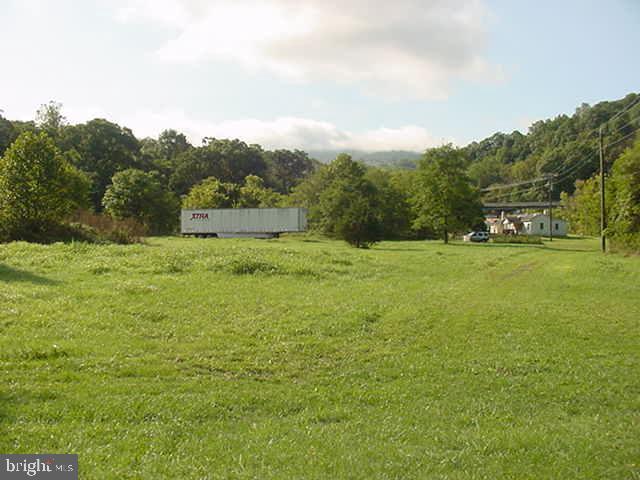 8 acres zoned commercial with over 600 ft state paved road front w/ 2 entrances * Includes two houses currently rented * Also  conditional use permit for warehouses * Great location only 1.5 miles to I-66 at Linden! * Property offers unparalleled accessibility with unlimited commercial use possibilities!