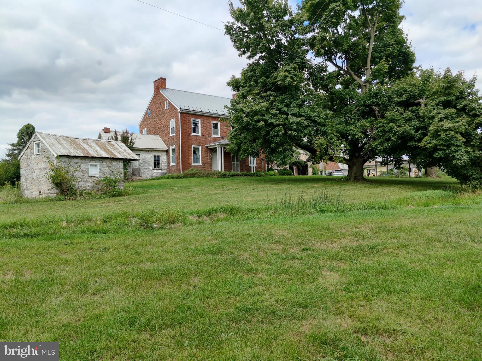 This property sits next to a Norfolk Southern Railway Intermodal Rail Yard , is 4 miles
from Hagerstown Regional Airport, close to 2 major Route 81 Interchanges (Exit #1 and
Exit 3) and very close proximity to Route 11 - Molly Pitcher Highway. Property sits
directly across the road from Walmart Fulfillment Center.

Subject property being sold along with  adjacent parcel # 01-0A27.010A.000000. 

Zoning - Industrial District of Antrim Township, Franklin County, PA:

Please contact Antrim Township for final accepted uses
Accepted Uses: Manufacturing, assembling, converting, altering, finishing, cleaning or any
other processing, handling or storage of products and materials. Building materials' storage,
lumber yards and lumber mills. Freight and truck terminals, distribution plants, warehousing and
wholesaling facilities. Printing, bookbinding and newspaper publishing.Research and design
offices and laboratories.
All uses that are similar to the previously stated and not otherwise prohibited.
Accessory uses and buildings customarily incidental to the previously stated uses, including
dwellings only for bona fide caretakers or watchmen.
Lodges and fraternal orders.
Health clubs, health spas and other similar establishments, subject to the requirements of Public
utilities (i.e., sewer, water, gas, etc.). Federal, state and local government offices and accessory
uses, and other municipal essential services (i.e.,fire, police, nonprofit recreational facilities,
etc.). Public schools and essential uses, provided that all outside active play areas are screened
from adjacent properties. Truck stops. A facility designed especially to be used for long-distance
truck drivers that may include but is not limited to restaurants, fuel pumps, repair garage, truck
service etc. Truck, semi trailer and full trailer sales. Uses where the primary business involves
truck traffic, including but not limited to semi trucks, tractor-trailers,eighteen-wheelers, etc.

Existing Buildings:

Building Site #1 -large brick, 4bed, 1 bath two story farmhouse, 30x34 wood - built equipment
shed with lean-to, 45 x 32 block garage with 3 overhead doors, 42 x70 two-story bank barn,
18x64 Wooden implement shed / chicken pen.

Building Site #2 - large brick, 4bed, 1 bath two story farmhouse, 18 x 36 wood implement
garage, 15x 30 wood shop / chicken barn, 52x100 two-story Bank Barn

Building Site #3 - 30x50 2 bed,1 bath rancher with 20x22 two car garage