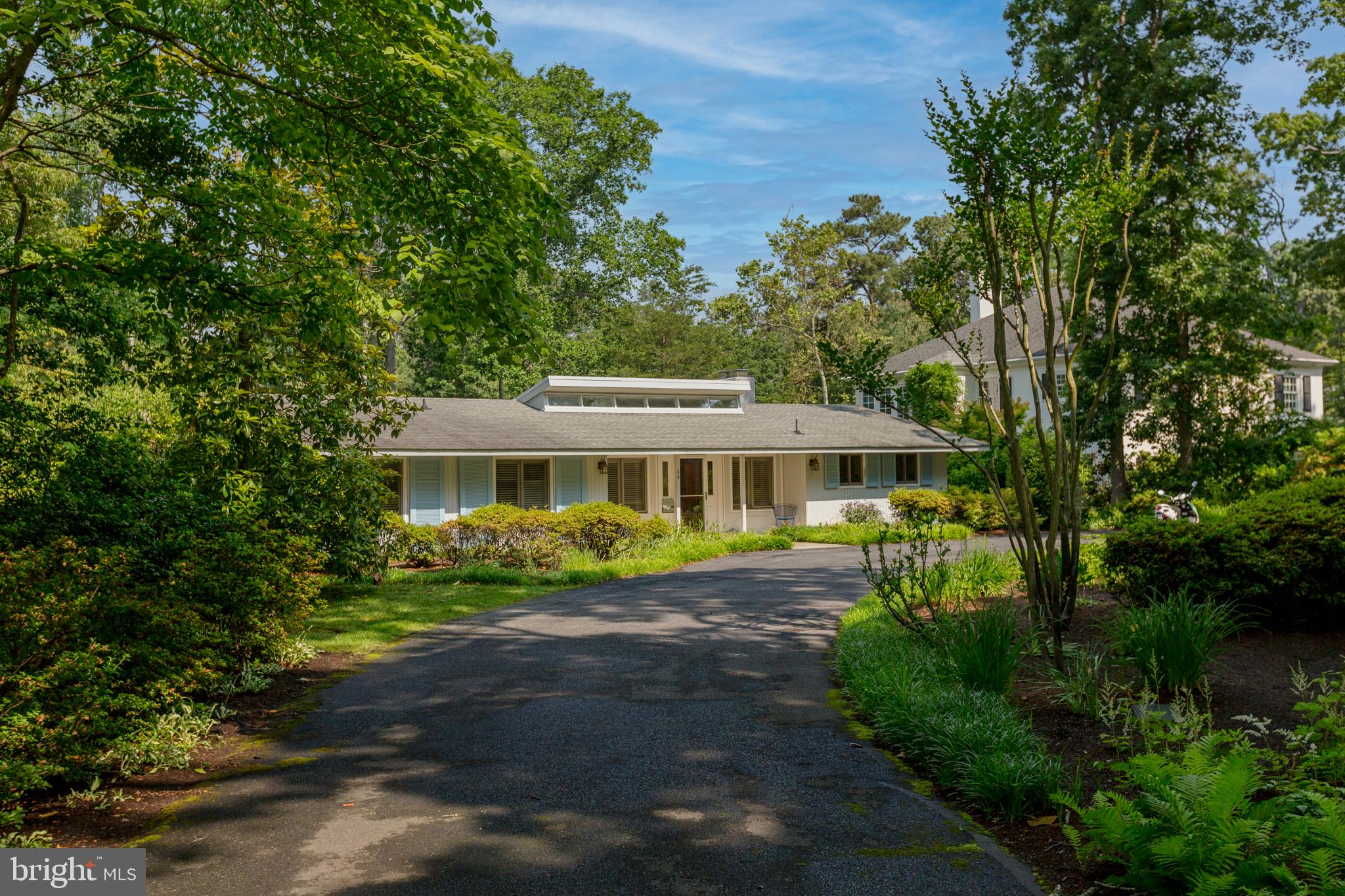 RARE canalfront opportunity to own a unique and rarely offered Henlopen Acres property. This canal-front town features 200 homes and is nestled adjacent to Rehoboth Beach. The home offers spacious, light-filled one-level living, a four season back porch and deck both overlooking the tidal waters of the Lewes Rehoboth Canal.  The canal features access to Rehoboth Bay, the Delaware Bay and the Atlantic Ocean.  As you enter the home you are greeted with views of the water, oversized living room, a wood-burning fireplace and expansive space for dining and entertaining. The kitchen opens to a bright living room with a wood burning fireplace and sliding doors to the water.  The owner's suite has an adjacent office and sliding glass doors which open to the back deck. Three additional bedrooms and a shared bathroom complete the sleeping quarters.  The additional appeal of this home is an approved bulkhead and dock permit that can potentially be conveyed to a Buyer with DNREC approval (permit expires Dec 2024).  Additional features of the town of Henlopen Acres include the marina (wait-list can apply) and the private beach, Block W, along with the opportunity to join the Henlopen Acres Beach Club and tennis club. This property affords endless possibilities to enjoy now or to renovate. Offered "as is." The town of Henlopen Acres has the first right of refusal on all home sales, there is also an architectural review process for any lot/structure improvements/updates.  Rentals are permitted with restrictions in the Town of Henlopen Acres.