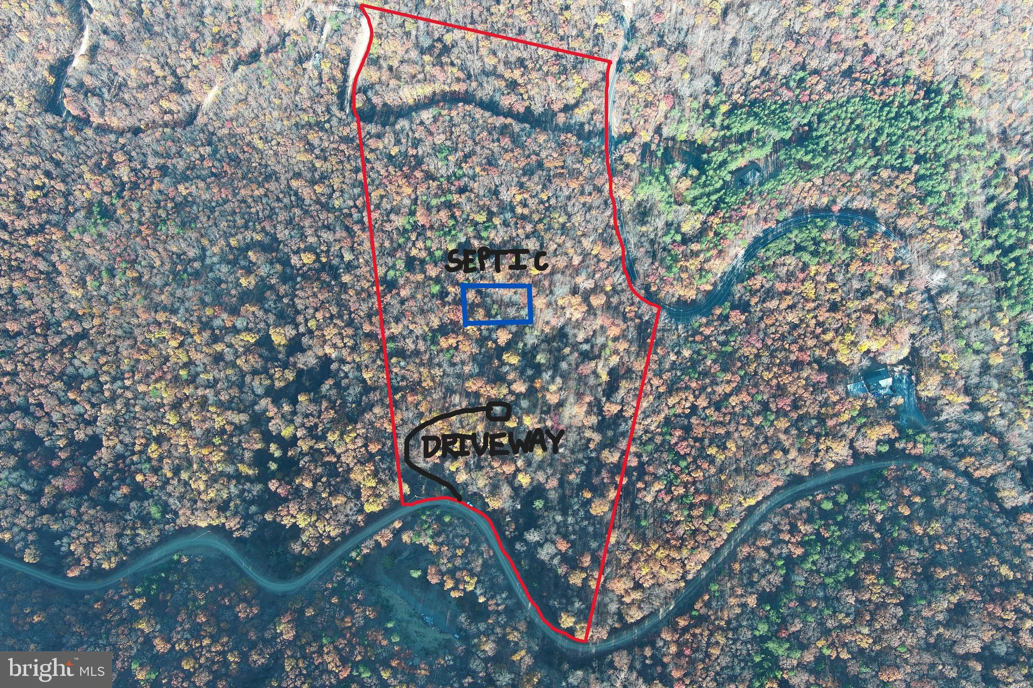 20 Acres of Mountain Serenity! This beautiful wooded parcel features an open hardwood forest with long-range westerly views overlooking the South Branch River Valley. Ready for your dream home or getaway, the property already includes a driveway and installed septic system. Enjoy the perfect balance of privacy and accessibility — just minutes from multiple public access points to the South Branch of the Potomac River and hunting lands in the White Horse Mountain Wildlife Management Area. Convenient dual access from two subdivision roads at both the top and bottom of the property enhances flexibility and potential. A true gem for outdoor enthusiasts or anyone seeking a peaceful mountain retreat!