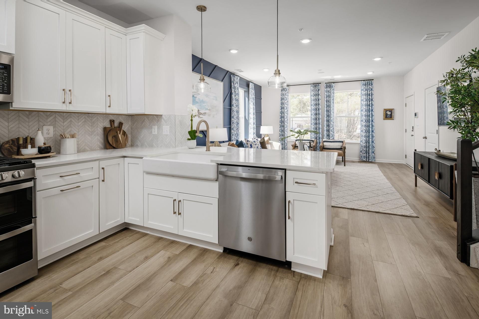 The most affordable new construction condo townhomes in Montgomery County! Welcome to the Avery—a spacious 2-level garage townhome condominium, now under construction in the heart of Montgomery Village. Offering 1,619 sq. ft. of beautifully designed living space, this home includes 3 bedrooms, 2.5 bathrooms, and an attached garage. The open-concept floorplan features a U-shaped kitchen with upgraded appliances, a primary suite with a tray ceiling, and a gorgeous spa-like bath with dual sinks. The secondary bath also features dual sinks, while abundant storage space throughout the home ensures functionality meets style. Set within Montgomery Village, residents enjoy access to an incredible array of resort-style amenities through the Montgomery Village Foundation, including: 6 community pools 18 tennis courts Volleyball, lacrosse, basketball & soccer courts Amphitheater & cricket field Dog parks & tot lots 330-acre park with lakes, walking & jogging trails All of this just steps away from shopping, dining, and everyday conveniences. Don’t miss your opportunity to own one of the most affordable new construction homes in Montgomery County—schedule your tour today! 
 *Photos may not be of actual home. Photos may be of similar home/floorplan if home is under construction or if this is a base price listing.