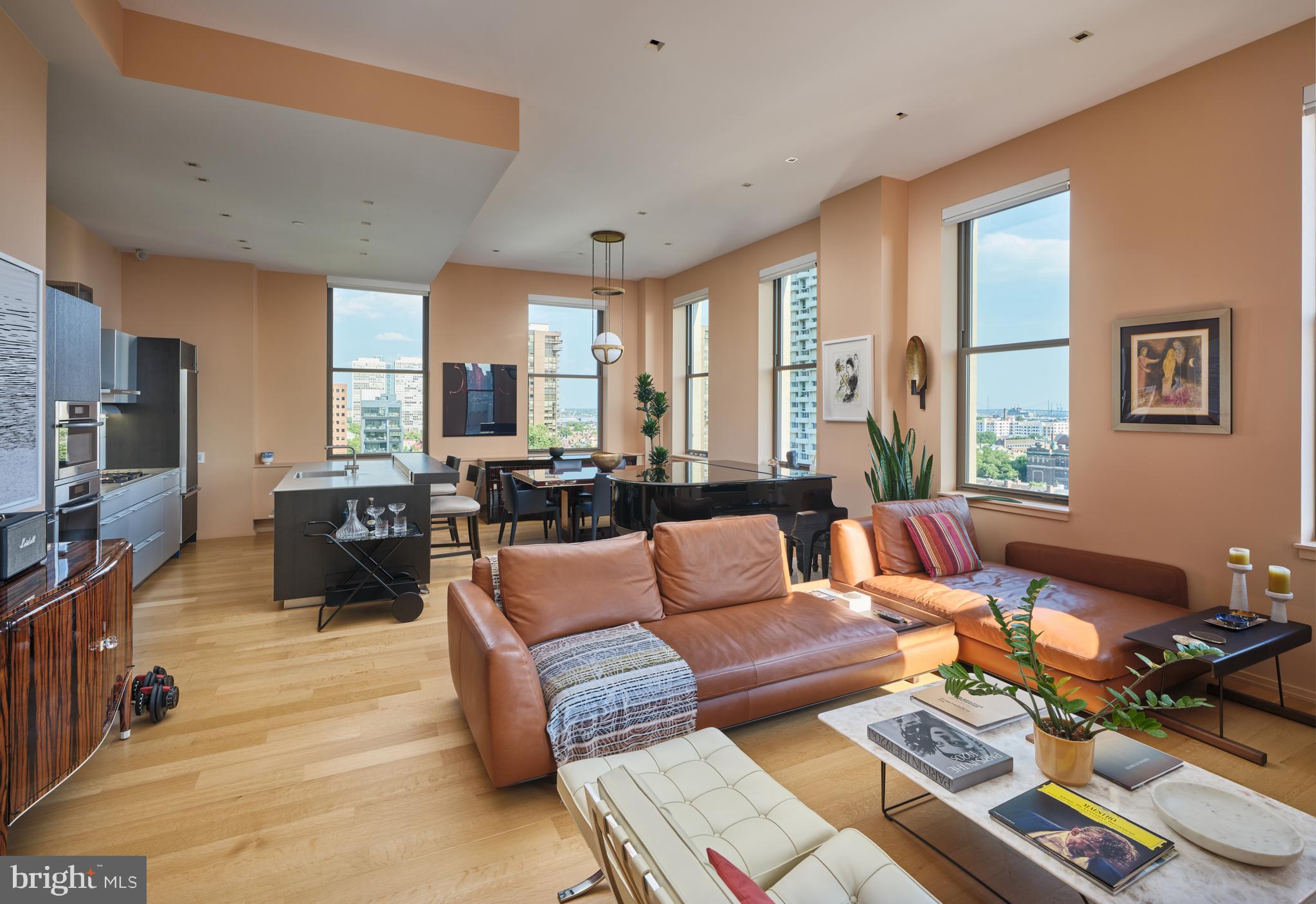 Discover a phenomenal opportunity to own an ultra-luxurious, 1,685-square-foot residence in the prestigious Ayer Condominium, overlooking historic Washington Square. Designed by acclaimed architect Wesley Wei, this stunning two-bedroom, 2.5-bathroom home perfectly pairs design-driven modernism with timeless elegance.

The residence boasts dramatic architectural grandeur with soaring 11.5-foot ceilings and expansive windows framing incredible, unobstructed views of the square. Every detail has been meticulously elevated with premium upgrades, including custom lighting, high-end flooring, solid doors, and designer hardware throughout. The ultimate owner’s suite serves as a spacious, sun-drenched sanctuary featuring a private sitting area and East exposure highliughting Washington Square and Bridges. A rare private terrace completes the home, offering an exclusive outdoor retreat.

Residents enjoy five-star building amenities that redefine urban living. The Ayer provides 24/7 concierge service, on-site valet parking, a state-of-the-art fitness center, and dedicated private storage. For ultimate convenience, a chauffeur-driven BMW 7-Series concierge car is also at your disposal. Experience unparalleled modern luxury in one of the city’s most historic and coveted locations.
