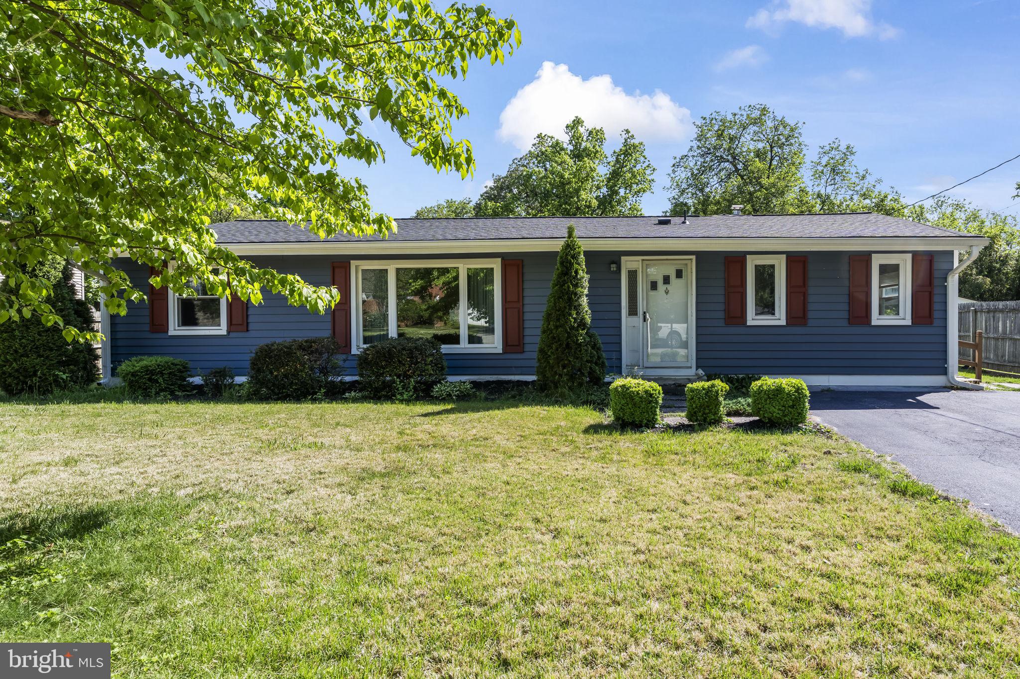 This 3-bedroom, 2-bath rambler sits on one of those private lots that just feels right the moment you pull up. And the best part? All the big-ticket stuff is already done!  New roof, new windows, new siding, and shutters, so you're not inheriting someone else's to-do list. They even encapsulated the crawlspace and added a dehumidifier and it's still under warranty! Inside, you'll find  a massive mudroom off the kitchen that'll quickly become the most used room in the house. Somewhere to toss the backpacks, kick off the boots, and take a breath before dinner.  There is a huge rec room off the back of the house and has a sunken conversation pit with a fireplace right in the center. It's the kind of room that makes you want to have people over. Game days, movie nights, or just mixing a drink and sinking into that conversation pit by the fire. Friends will never want to leave. There's also a full bath attached and an office, so if you'd rather turn this whole space into a giant owner's suite, you absolutely could. The backyard is flat, usable, and bigger than you'd expect. Great for a garden, a pool, entertaining, or just relaxing in the sun. There's even a double fence setup. One area is for hanging out and enjoying your evening and the other area for the pets! Keeping everything clean and separate! The perfect location and convenient to shopping and amenities! An easy drive to Baltimore, Annapolis, and DC!