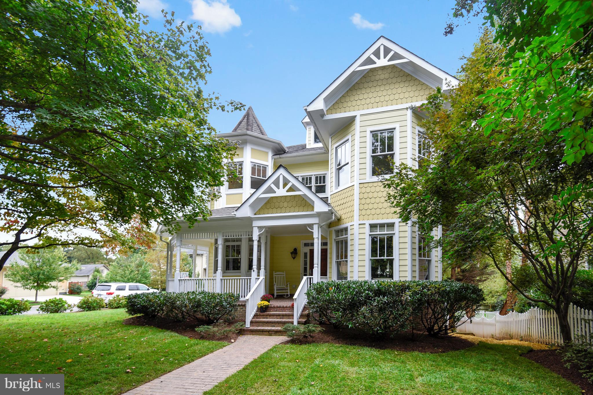Just listed in Woodmont and priced BELOW the assessed value. This charming Victorian is deceptively large with over 5,700 square feet on 4 levels, containing 5 bedrooms and 5.5 bathrooms. With wrap-around front porch this home is situated on a desirable corner lot, just one light to DC and within walking distance of bike trails and parks. The main level features Brazilian cherry hardwoods, an expansive living room, a study with built-in bookshelves, separate dining room with crown molding and tray ceiling, and a gourmet kitchen with butler's pantry and Subzero/Wolf appliances. The walk-out lower level provides easy access to the garage and side yard and includes a recreation room, den, full bath, and guest bedroom. The upper level includes a master bedroom suite (with sitting room and luxury bath), three additional generously-sized bedrooms, two bathrooms including a Jack and Jill bathroom, and conveniently-situated laundry room. The finished loft with full bath makes an excellent au pair suite, playroom, or hobby space. Other features include a whole-house backup generator & security system.