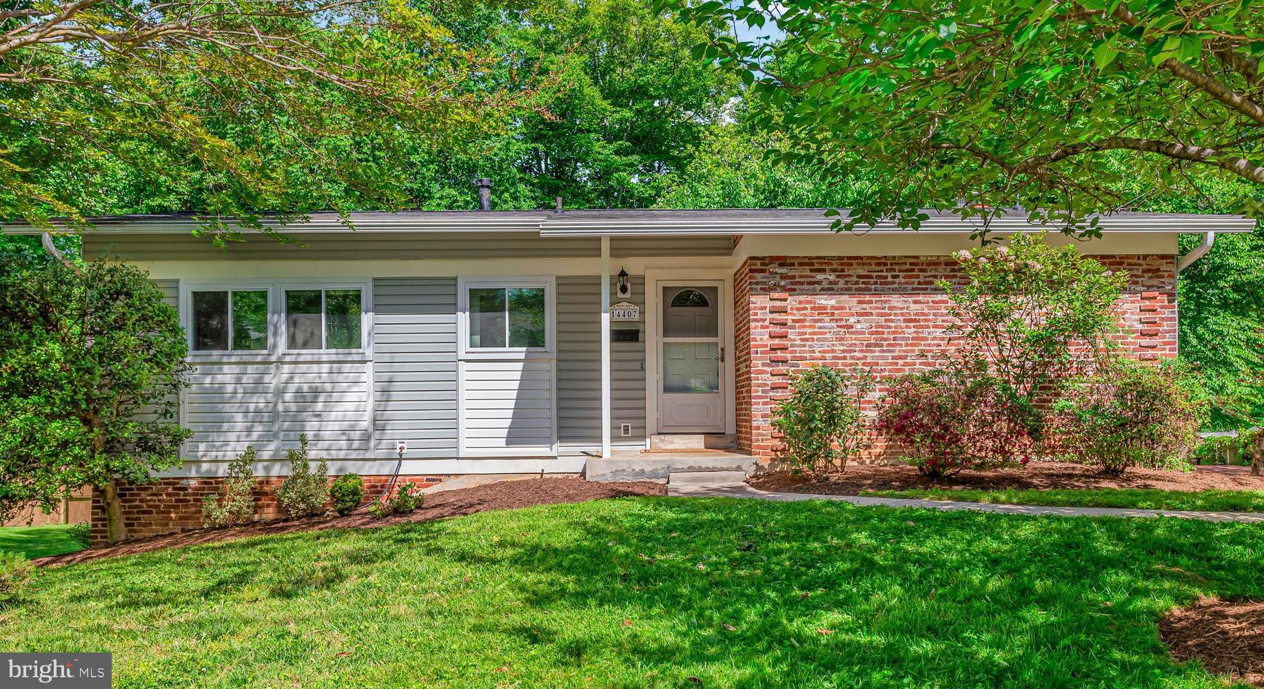 Welcome to 14407 Briarwood Terrace, a beautifully updated 4-bedroom, 3-bath rambler in the Manor Woods community of Rockville. For those who love nature, the home backs to Sycamore Creek and features a spacious, lush backyard, offering a peaceful blend of privacy, comfort, and convenience.

The sun-filled main level features refinished white oak hardwood floors, crown molding, recessed lighting, and an oversized bow window overlooking the serene yard. The spacious kitchen features quartz countertops, a new backsplash, ample pantry storage, and a bright breakfast area perfect for everyday living.

The spacious primary bedroom includes an updated en-suite bath, while two additional bedrooms offer peaceful views and large closets. The walkout lower level features a recreation room with a brick wood-burning fireplace, an additional guest suite with a bedroom, full bath, and a versatile home office or fitness space.

Convenient to Rock Creek Park trails, Glenmont and Rockville Metro stations, shopping, dining, parks, and commuter routes, this move-in-ready home also includes a private driveway for off-street parking.