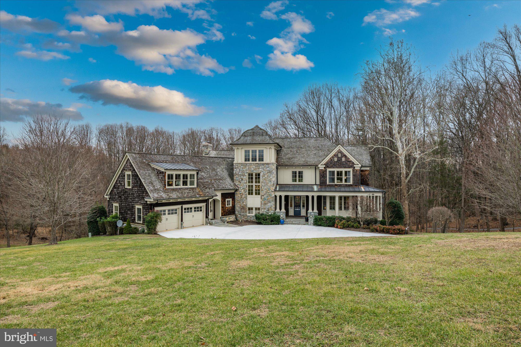 This custom-built home offers a refined fusion of gracious space and approachable scale delivering a carefully considered balance of casual living with elegant entertaining. 13305 Evening Ride Way was built to welcome and impress you from every angle.

Main Level: 10’ ceilings, impeccable flow with formal entertaining spaces on one wing and casual family space on the other. Formal living room and dining room offer opportunities to host stylish affairs. The chef’s kitchen features high-end appliances, an island and is open to a breakfast area and a family room with wood burning fireplace and stone surround. Warm & bright sitting room leads to a magnificent flagstone terrace overlooking nature. Covered flagstone porch & 20’ screened porch perfect al fresco dining. Main floor bedroom suite w/ en-suite bath. 

Second Level: Hosts four bedrooms and three full baths. Primary bedroom suite enjoys its own private wing, consists of a primary bedroom with gas fireplace, bathroom with soaking tub, large WIC, private sitting room and private library. Second and third bedrooms share dual-entry bath and fourth bedroom has private bath and WIC. Also offers reading nook, laundry room and hall closet.

Third Level: Tower room with three exposures to enjoy yoga, a glass of wine or to use as art studio or observatory.

Lower Level: Finished walk-out lower level in a class of its own - 9’ ceilings, natural light on three sides, large catering kitchen, dining room, living room, second primary bedroom suite with sitting room and gas fireplace, WIC and en-suite bath, additional bedroom and full bath, flex room, craft room & laundry room. Finishes mirror the quality of upper levels. Can be used for entertaining, short-term or long-term guests, or quarters for au-pair, security detail or household staff. 

This home is elevator-ready with a closet on the lower level, main level and second level that can easily be converted for this purpose. The HOA has approved a plan for an infinity pool on the rear of the property!

Ask Listing Agent for sellers’ list of $400,000 of recent upgrades!

Merry Go Round Farm community offers equestrian stables, riding fields, tennis courts, an outdoor pool and landscaping services – all included in the low HOA fee. Annual snow removal services are available at a favorable rate. Access to the C&O Canal Trail is a marvelous way to enjoy nature along the Potomac River.