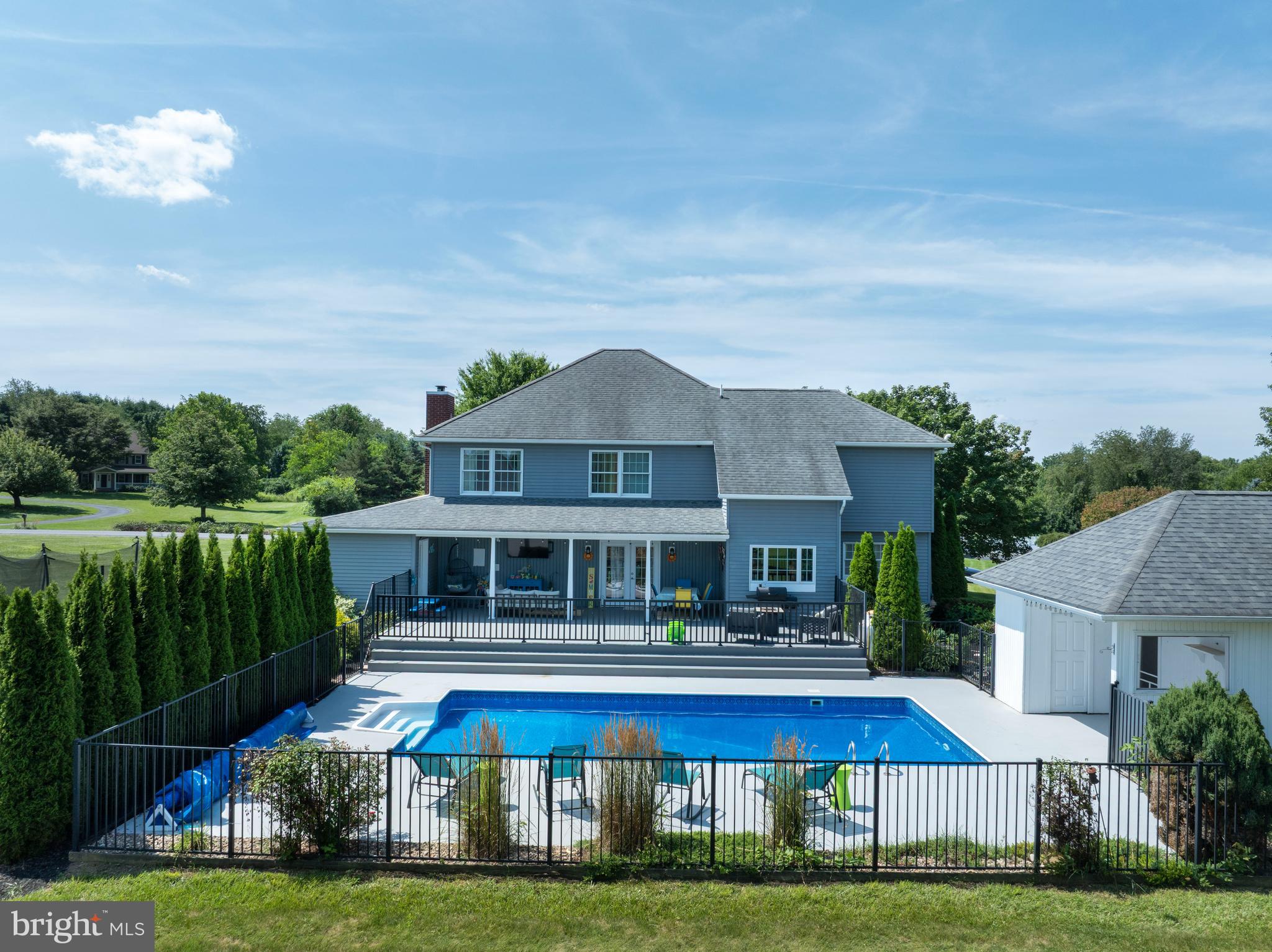 Positioned on a beautifully landscaped 1.71-acre corner lot in the highly desirable Wyndtryst community, this exceptional Richard Payne custom residence offers a compelling blend of timeless architecture, thoughtful updates, and resort-inspired amenities. Designed with both elegance and comfort in mind, the home showcases soaring vaulted ceilings, expansive living spaces, and a seamless connection between indoor and outdoor living.

The updated kitchen serves as the heart of the home, featuring a new refrigerator, dishwasher, sink, and refreshed finishes that complement the home’s warm, sophisticated aesthetic. Throughout the residence, extensive improvements—including fresh interior paint, updated lighting, renovated baths, new flooring in the lower level office, and custom closet shelving—create a refined, move-in-ready environment with exceptional attention to detail.

Outdoor living is equally impressive. A newly constructed rear deck overlooks the private backyard, where a heated in-ground pool and charming pool house provide an extraordinary setting for entertaining, relaxing, and enjoying the surrounding landscape. New fencing enhances privacy while maintaining the property’s open, estate-like feel.

The finished lower level offers remarkable flexibility with additional living space, a full bath, and endless possibilities for recreation, fitness, or guest accommodations. An additional detached outbuilding provides valuable storage or workshop space.

Ideally located just minutes from Penn State University, downtown State College, and everyday conveniences, this distinguished property offers the rare opportunity to enjoy the tranquility of a private acreage setting without sacrificing accessibility. Meticulously maintained and extensively updated, 532 Kristina Circle is a residence where craftsmanship, lifestyle, and location come together in exceptional harmony.