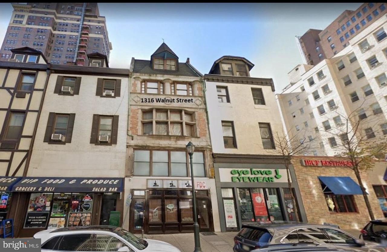 Opportunity  is knocking! This property is situated in a highly desirable, high foot traffic area - Center City. The building spans from street to street and features one commercial space along with nine residential units, offering excellent investment potential. The commercial space is approximately 3,820 sq ft, consists the first floor and mezzanine, has approximately 5 years remaining lease term with two 5yr options. With the 9 apartments, which consists of 8 two-bedroom units and 1 one-bedroom unit. Not to mention 4 of the units are bi-level. Currently, 7 of the 9 apartments are leased to tenants who operate Airbnb businesses. Liquor license (R) is also available to sell for additional $200,000. Schedule your showing today!!!