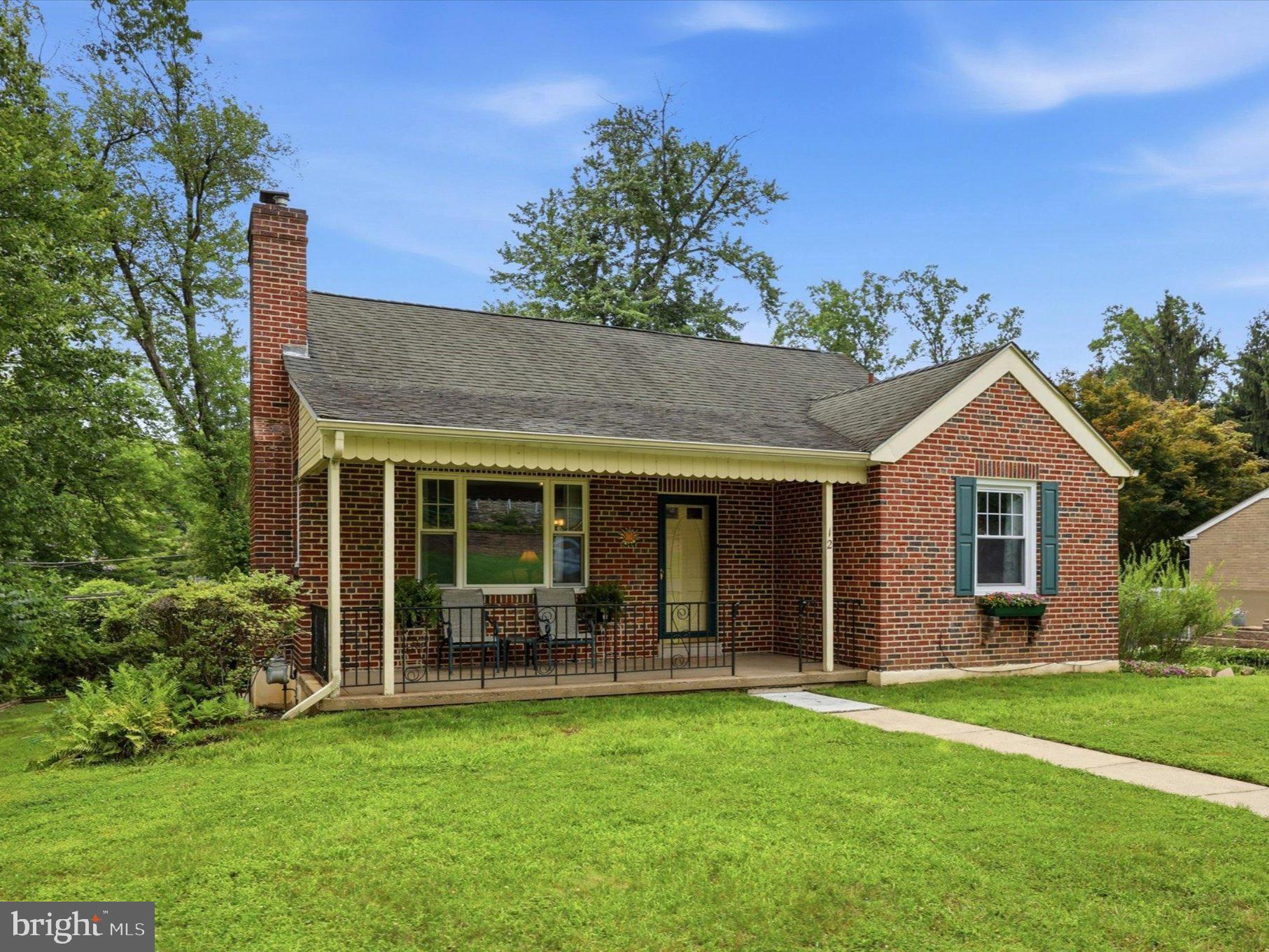 Welcome home to this charming 3-bedroom, 1.5-bath Cape, tucked into a tree-lined neighborhood where mature surroundings create a peaceful setting from the moment you arrive. A welcoming covered front porch sets the tone for a home filled with character and offering a thoughtful blend of comfort and functionality. Step inside to a warm living room featuring beautiful wood floors and a wood-burning fireplace that serves as the focal point of the space. Large windows bring in an abundance of natural light, creating the perfect backdrop for quiet evenings at home or time spent with family and friends. The dining room is a true highlight, where oversized windows frame views of the backyard and surrounding greenery. Just beyond, the kitchen offers a functional layout with a breakfast bar and direct access to the rear deck, making it easy to take meals and gatherings outdoors. Two bedrooms and a full bath are conveniently located on the main level, while upstairs you'll discover a generously sized third bedroom with distinctive Cape-style architecture and room for a sitting area, home office, or other flexible use. The finished basement adds valuable bonus living space with a recreation area, built-in bar, powder room, and separate laundry room. Whether used for movie nights, game days, hobbies, or entertaining, this versatile level provides plenty of possibilities. Outside, the large Trex deck offers the perfect spot for grilling, outdoor dining, or simply unwinding while enjoying the tree-lined surroundings. An attached garage and exceptionally long driveway provide convenient parking and added functionality. Additional features include natural gas heat and ductless mini-split systems for added comfort. Full of charm, character, and versatility, this Cape is an ideal opportunity for those looking to make a home their own. Come see all that this special property has to offer and schedule your private showing today!