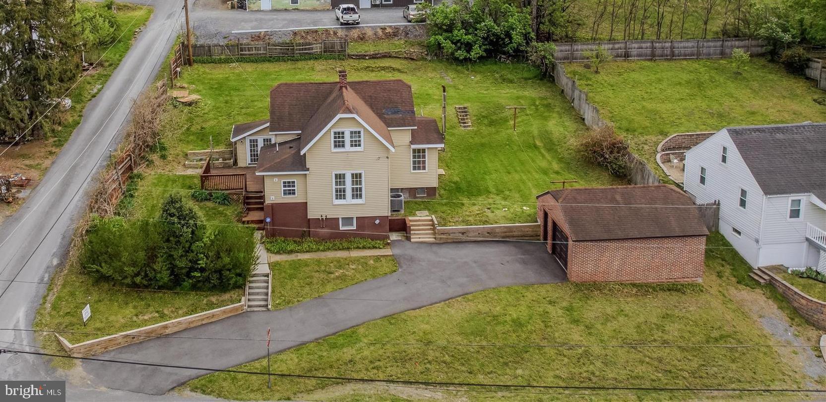 Price reduction! Investors welcomed! Home had an interior facelift and now it needs some exterior love that sellers are not able to continue. Home inspection revealed repairs needed-seller is selling AS-IS.
Charming In-Town Living in the Heart of Berkeley Springs!
Welcome to 151 S Laurel Ave—where convenience meets character. Just minutes from historic downtown, you’ll love being close to local shops, dining, spas, and all the charm this town has to offer.
This inviting home has been thoughtfully updated with new flooring, modern appliances, and refreshed bathrooms—giving you the perfect blend of comfort and style. Inside, you’ll find bright, welcoming spaces ideal for everyday living or weekend getaways. Yes, you can Airbnb this one!
Enjoy your morning coffee or unwind in the sun filled enclosed porch-what a great spot even on a rainy day, or step out onto the sizeable deck—perfect for entertaining, grilling, or simply soaking in the peaceful surroundings.
The property also offers a 10 x 20 garage for extra storage, along with paved parking for added convenience. A manageable yard provides space for gardening or relaxing outdoors.
Whether you’re looking for a full-time residence, weekend retreat, or investment opportunity, this home checks all the boxes