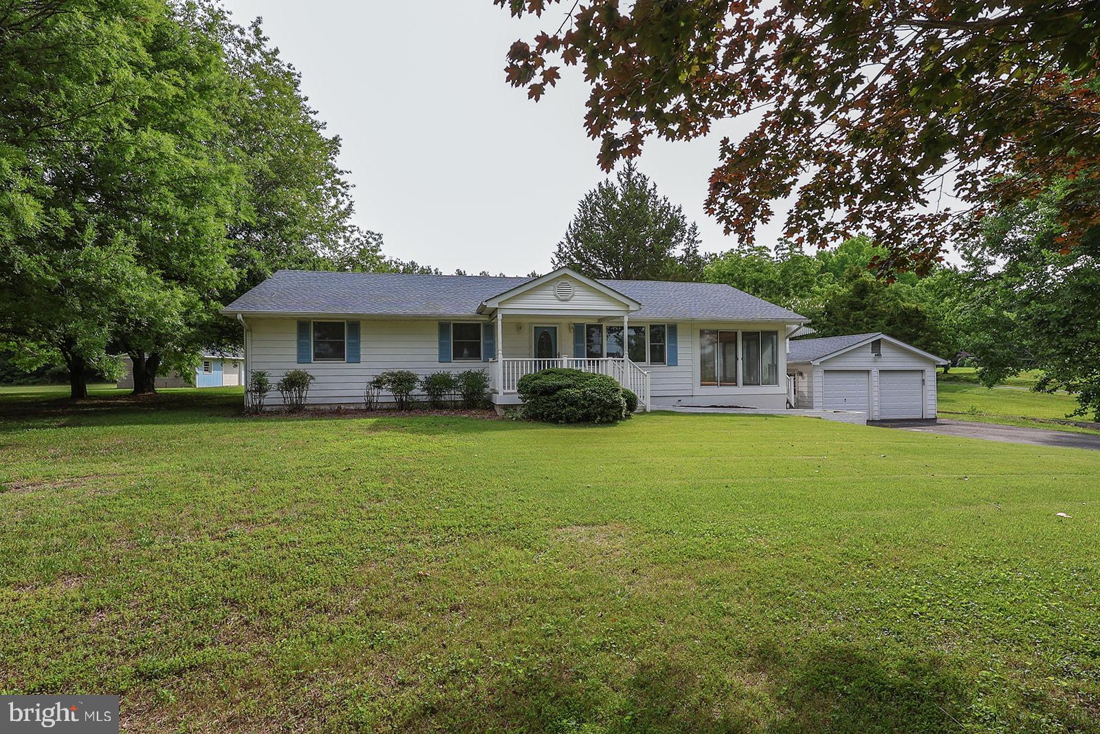 Located just south of St. Mary's City, this 1,604 sq. ft. rambler sits on a private, open 3-acre lot with views of Church Cove. The property offers a rare combination of usable acreage, water views, and multiple outbuildings in a desirable location.
The home features original hardwood floors, 2 full bathrooms, a glass-enclosed side porch, and a front porch overlooking Church Cove. Two detached 2-car garages provide plenty of space for vehicles, storage, or workshop use.
Solid potential for a buyer looking to renovate and make it their own. The level, open lot offers room for gardening, recreation, or future improvements.