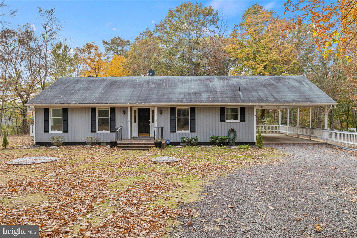 Motivated Seller! Selling Agent offering buyer $575 Shield Essential plan through American Home Shield.  Come on in to this Adorable Rambler surrounded by lovely trees with a circle Driveway, Covered Carport that takes you into this newly painted beautiful home. In the Living Room,  you can cozy up by the Fireplace and enjoy the Brand New French Doors that lead you to the first deck with beautiful views of the Fall foliage. As you walk into your your Kitchen you will notice Lovely Cabinets, an Island all with Granite Countertops and an Eat-In-Dining. Make your way through the hallway to find a Full Hall Bath, Two Rooms and then your Master. In the Master you will enjoy Two Closets, An On-Suite Full Bath and a Deck for Relaxing! Outside you will enjoy the mostly cleared lot with Beautiful Trees Surrounding. Don't miss your chance, call your Agent today!! Sold in “AS-IS” condition due to seller’s inheriting the property.