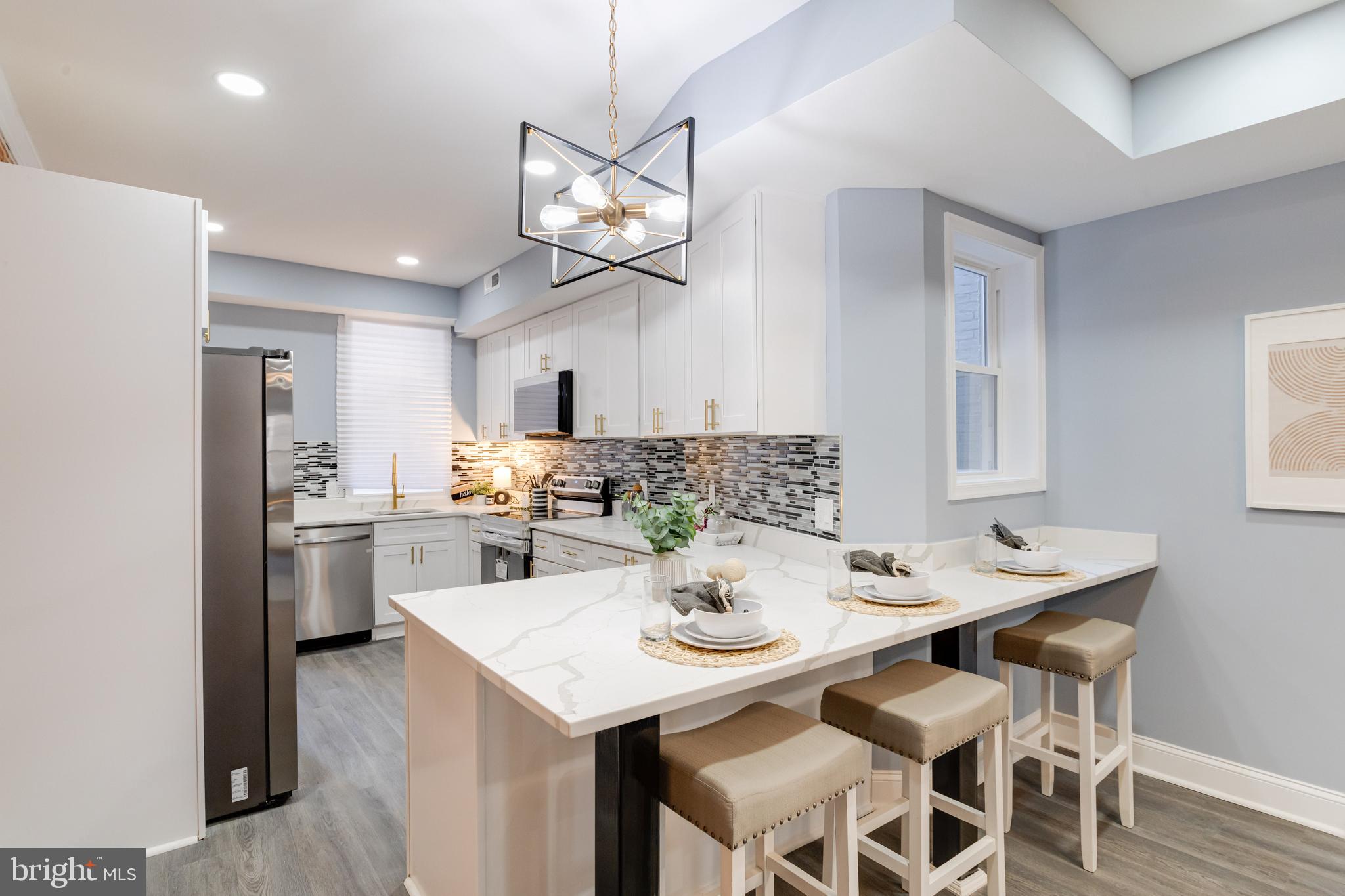 Welcome to your dream home! This beautifully renovated Baltimore property offers a warm and cozy atmosphere, perfect for modern living. Spanning three levels, this home features an inviting open floor plan that effortlessly blends style and functionality. The heart of the home is the stunning kitchen, equipped with sleek stainless steel appliances and elegant quartz countertops—ideal for both everyday meals and entertaining guests. Enjoy evenings in the spacious living area, creating the perfect setting for relaxation. Upstairs, you’ll find spacious bedrooms, each with their own en-suite bathrooms, ensuring comfort and privacy for everyone. There is private parking in the rear, underneath the newly egineered design deck. Don’t miss the chance to own this exceptional property that combines luxury, comfort, and convenience. Schedule your private tour today! Seller paid one year home warranty included.