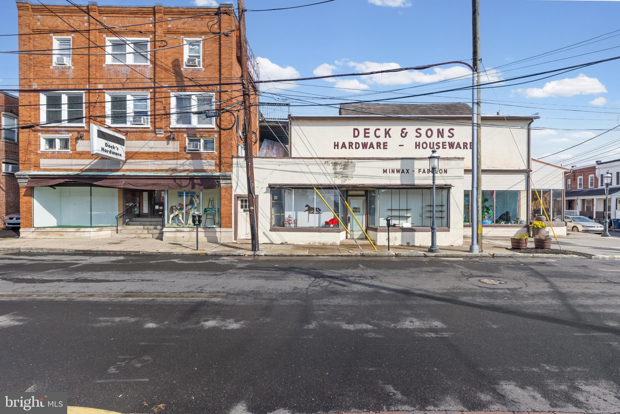 A rare opportunity to own a high-profile corner in downtown Ambler, PA.  This retail location was
once Deck’s Hardware store, founded over one hundred years ago. The property comprises two
parcels, with two structures, a retail building and a mixed-use building with 3 dwelling units, that
combine to make over on 28,000 Sq Ft of retail and rental space. The site is zoned DC,
Downtown Commercial, for retail, business or professional office, bank or financial institutions,
office, restaurant/bar, personal service shop, publishing or printing, and residential (via special
exception) development. This commercial area is serviced by restaurants/bars, local retailers,
convenience stores, support services, public transportation and is one block from the Ambler
train station. Nearby are shopping centers, freestanding retail outlets, residential neighborhoods and office parks located along Skippack, Butler and Bethlehem Pikes.