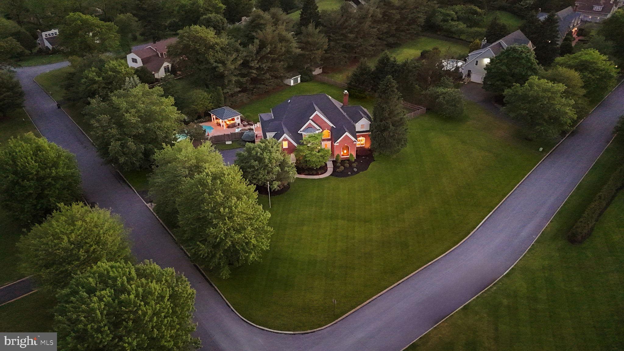 Proudly offered by Mark & Tina, this impeccably maintained Jericho Valley residence showcases exceptional craftsmanship, extensive millwork, and the unmistakable quality of a former David Schrenk model home. Thoughtfully upgraded throughout, this stunning 4-bedroom home blends timeless elegance with resort-style living. Designed for both comfort and flexibility, the home features two spacious owner’s/in-law/guest suites, 3 full baths, and 2 half baths. The beautifully renovated gourmet kitchen is equipped with high-end appliances, an LPG cooktop, marble countertops, abundant custom storage, a separate wine bar, and a butler’s pantry—ideal for entertaining and everyday living alike. Sunlight fills the inviting sunroom through three walls of windows, while the fully finished basement and game room provide expansive additional living space, natural light, and three oversized storage rooms. Recent improvements and premium features include: Andersen 400 Series windows throughout, Renovated owner’s suite and luxury bath, Refinished hardwood flooring, New carpeting in the family room and owner’s suite, Interior and exterior painting, Updated insulated garage doors with windows, Jeld-Wen, Pella, and Andersen exterior doors, New roof (June 2025) with dual solar-powered attic exhaust fans, Whole-house generator, Whole-house water softener system, 2-zone HVAC with LPG heat, Three Ring security cameras, Pennsylvania bluestone front porch, Professional landscape and accent lighting. The backyard is a true private retreat, offering an extraordinary outdoor recreation and entertaining experience. The Sylvan in-ground pool—completely replastered and retiled in June 2024—features an LPG heater and lighting, accompanied by a six-person hot tub, stamped concrete pool deck, and beautifully landscaped grounds. A standout feature is the custom covered pool cabana (18’ x 14’), thoughtfully appointed with: Refreshment center with sink and water service, Marble countertop bar, Weatherproof cabinetry, changing room, Recessed lighting, CATV and wired audio speakers, Ceiling fan, Outdoor hot/cold shower, Exterior water bib, Standing seam metal roof with gutters. Additional exterior highlights include a TimberTech and Azek rear deck with covered porch and dual ceiling fans, a fully fenced yard with pool privacy fencing, professionally maintained landscaping, and a telescoping flagpole. This exceptional Jericho Valley property offers refined indoor living, unmatched outdoor amenities, and true pride of ownership at every turn. Located in the award winning Council Rock School District (CR North HS) and close to shopping, restaurants and commuting routes. Arrange your private tour today as this one won't last!