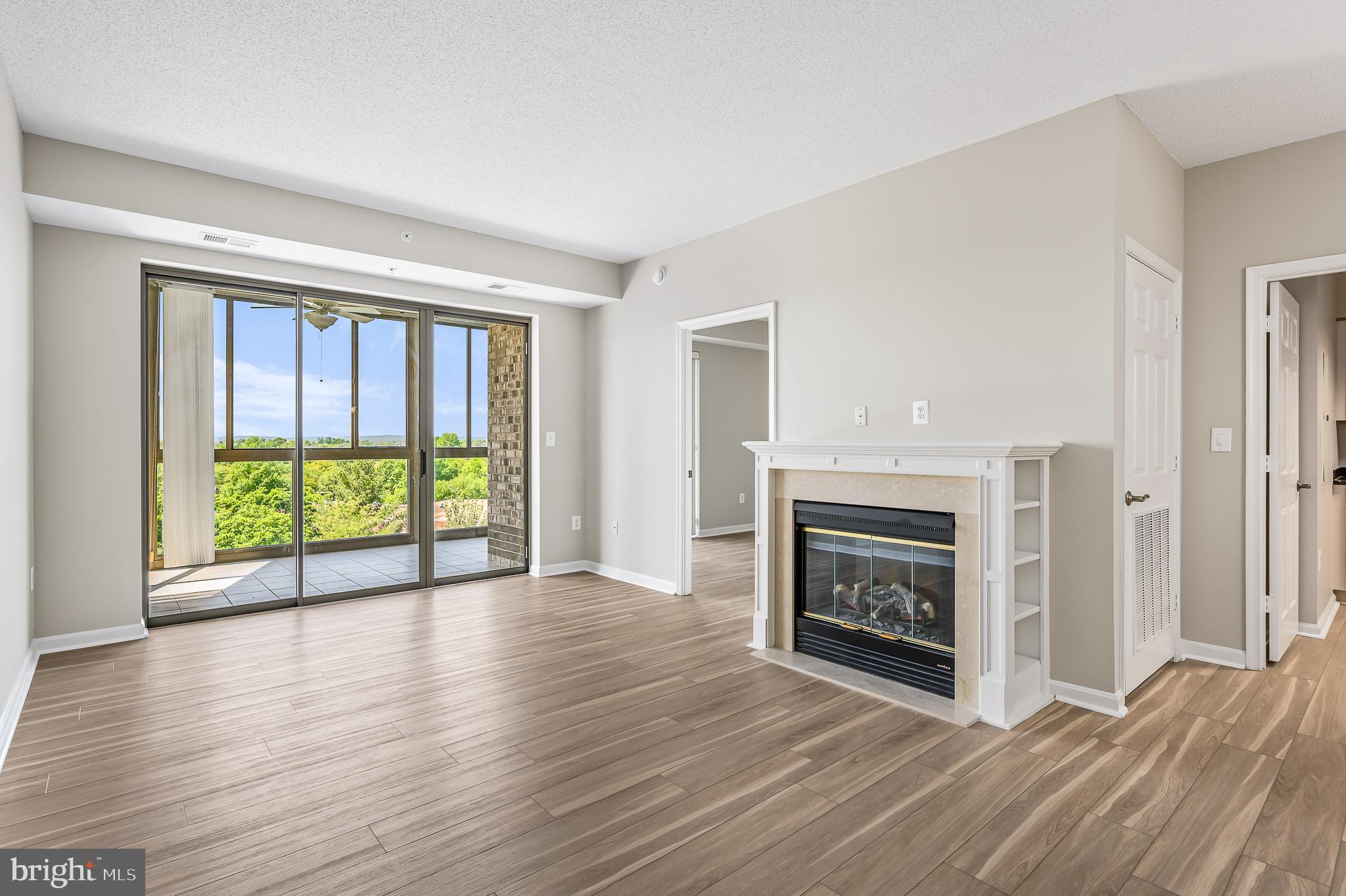 Experience elevated living in Unit 1022 in the highly sought after 55+ community of Lansdowne Woods! This beautifully updated condo is a perfect blend of modern comfort and serene surroundings. Step into a space adorned with brand-new luxury vinyl plank flooring and freshly painted walls, creating a fresh and inviting atmosphere.

The kitchen is a true standout, featuring sleek black granite countertops and stainless steel appliances—ideal for cooking enthusiasts or casual entertainers. The living area exudes warmth and charm with its built-in electric fireplace, perfect for cozy evenings. 

The primary bedroom is a true sanctuary, offering ample space, abundant natural light, and its own ensuite bath for your ultimate privacy and convenience. The second bedroom is equally versatile, perfect for guests, a home office, or a hobby room—whatever suits your lifestyle.

One of the highlights of this 10th-floor gem is the sunroom, where you’ll be treated to breathtaking views of lush greenery and the nearby resort. It’s the perfect spot to unwind, sip your morning coffee, or simply soak in the tranquility. As an added bonus, this property includes a convenient storage unit, providing extra space for all your belongings. Room L1-#146. Plus, residents will enjoy plenty of parking, ensuring ease and convenience for both you and your guests.

As part of Lansdowne Woods, residents enjoy an array of world-class amenities, including a clubhouse, fitness center, indoor pool, tennis courts, walking trails, and social clubs. It’s more than a home; it’s a lifestyle that fosters community and wellness. For added convenience, this property includes a storage unit and ample parking for residents and guests alike.

Modern updates, luxurious amenities, and a serene setting come together in this exceptional condo. Don’t miss the opportunity to call it home!