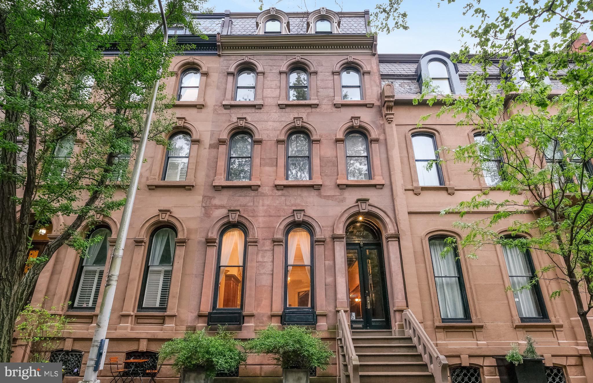 DYNAMIC RITTENHOUSE SQUARE  RESTORED MANSION! This 7000 Square foot MUSEUM CALIBER residence  offers perfection, luxury, and a return to elegance without compromise. FIRST Floor formal  living room with 15 ft ceilings, perfect crown molding and fireplace, is just off THE most OUTSTANDING dining room , with its own fireplace with  7 foot+ mantle, hand painted ceilings, and 2 French doors leading out to terraces over looking the charming  patio area. Master chef's kitchen with radiant heated floors, fire place, high end appliances and what feels like miles of counter space.  Double doors leading out to the patio, and access to the TWO car gated PARKING area, complete this level. On the second floor of this SUN-FILLED brownstone , you will encounter the MOST EXQUISITE main bedroom, with a fireplace, decorative plaster ceiling, dressing room with it's own  fire place, and an  all marble bath. There is also a library on this level, with it's own fireplace,  antique  restored wood carvings, and a beautiful south facing window and window seat.
The next 2 levels boast 4 additional perfectly appointed bedrooms and 3 additional Baths. Each level of this home is more magnificent than the next, boasts original GUIDED AGE type woodwork, and decorative hardwood floors.  Minutes from The best dining , entertainment,  University of Pennsylvania,  Drexel University and Of course RITTENHOUSE SQUARE.