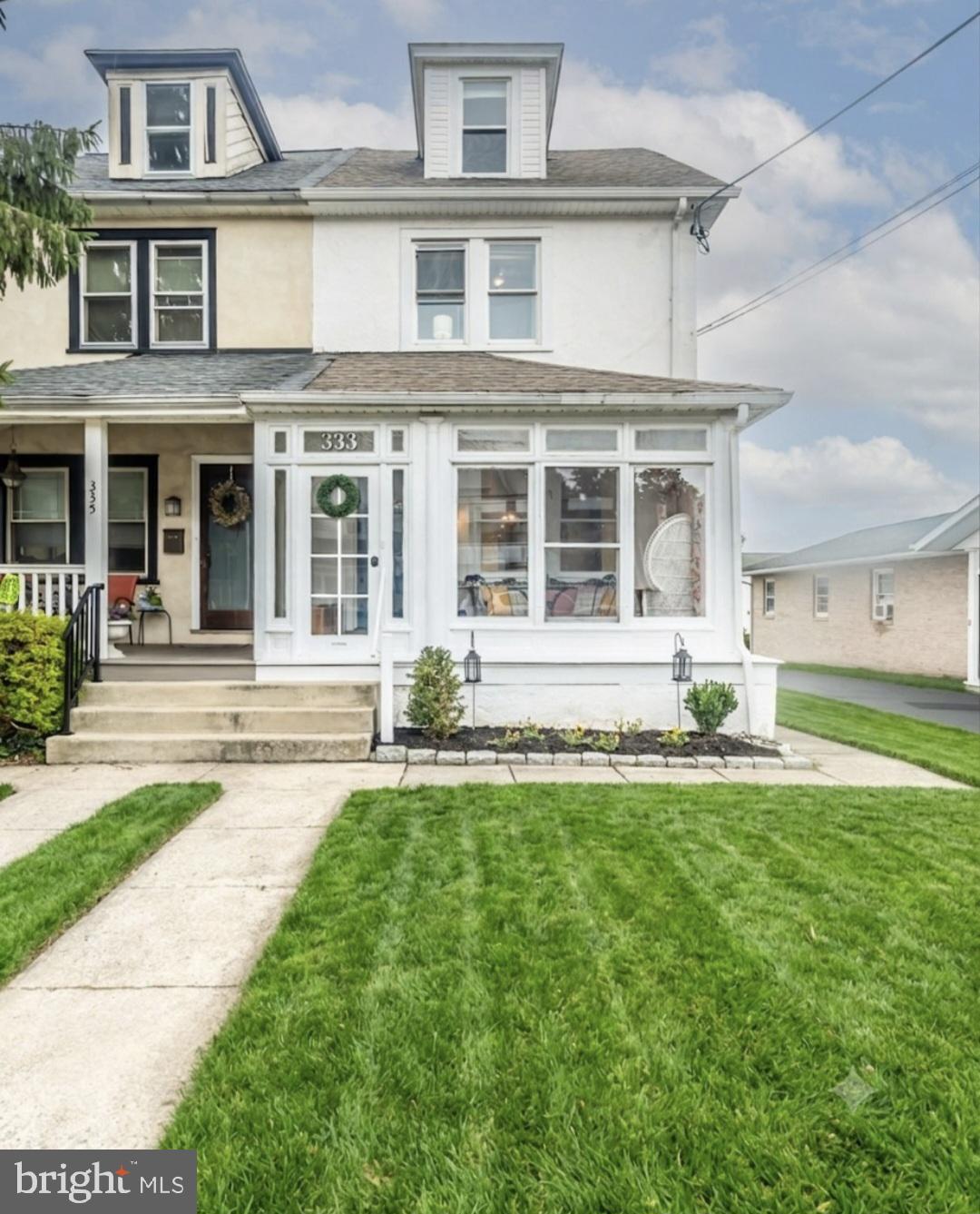 Welcome home to this charming 4-bedroom, 1.5-bathroom twin that perfectly blends classic character with an unbeatable Borough location! From the moment you step inside, you'll love the timeless beauty of the original hardwood floors, a convenient main-floor powder room, beautiful sunlit enclosed porch, and a large eat-in kitchen. The second floor features three bedrooms and a hall bath, while the third floor offers a private, spacious fourth bedroom complete with a huge walk-in closet. Downstairs, the versatile, partially finished walk-out basement adapts easily to your needs as a family room, home gym, playroom, etc., while still hosting a dedicated laundry room and ample storage space. Your outdoor oasis awaits out back, featuring a fantastic deck right off the kitchen, a patio designed for effortless outdoor entertaining, a nice-sized yard, a 1-car detached garage, and one additional off-street parking space. Best of all, you can enjoy a truly walkable lifestyle, located just a short stroll away from the Downingtown train station, local restaurants, and shops!