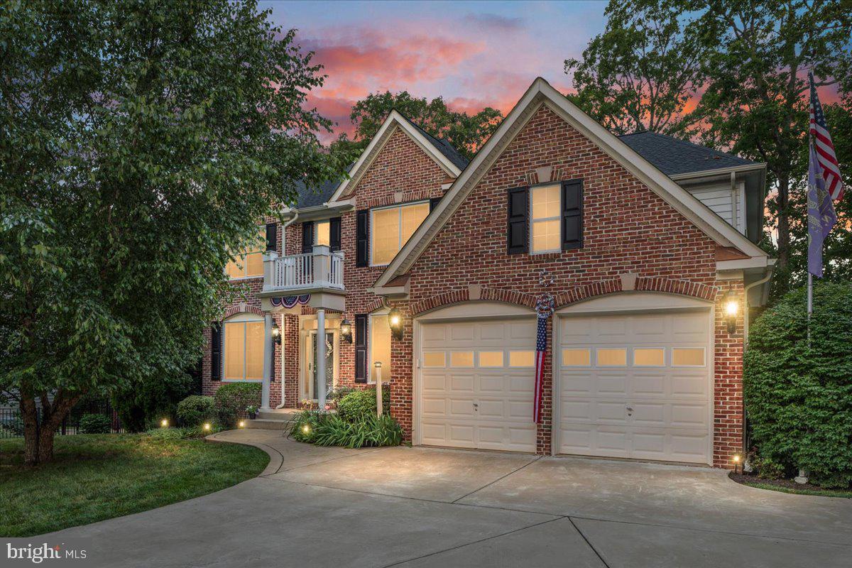 Nestled on a private half-acre cul-de-sac lot, this impressive brick-front colonial offers more than 4,000 finished square feet of beautifully designed living space across three finished levels. Featuring 5 bedrooms, 3.5 bathrooms, and a rare four-car garage configuration with both an attached two-car garage and a detached two-car garage, this home seamlessly blends comfort, functionality, and exceptional outdoor living.

The heart of the home is the gourmet kitchen, thoughtfully updated with quartz countertops, a center island, stainless steel appliances, tile backsplash, and abundant cabinetry, creating the perfect space for everyday living and entertaining. The spacious floor plan offers generous living and gathering areas, including a dramatic family room with soaring ceilings and a cozy fireplace, as well as a main-level office ideal for working from home.

Upstairs, the expansive primary suite provides a true retreat, complete with a large walk-in closet and a beautifully renovated ensuite bath featuring custom vanities, ceramic tile, and a luxurious frameless glass shower. Additional bathrooms throughout the home have been tastefully updated with high-end finishes and timeless design.

The fully finished lower level expands the living space with a fifth bedroom, full bathroom, and versatile recreation areas perfect for guests, hobbies, fitness, or movie nights.

Step outside and discover your own private backyard oasis. Enjoy summer days by the sparkling in-ground swimming pool, unwind on the screened-in deck overlooking the fenced yard, or gather with friends and family on the spacious patio surrounded by mature trees and lush landscaping. The combination of outdoor amenities and privacy makes this property ideal for both relaxation and entertaining.

Offering an exceptional blend of indoor elegance and outdoor enjoyment, this beautifully updated home is a rare opportunity to own a private retreat while remaining conveniently close to shopping, dining, commuter routes, and everyday conveniences.

Roof and gutters, lower level carpet, pool pump : 2025. Windows, gas water heater, dishwasher, sump pump : 2024. Interior and exterior painting to include cabinetry : 2023. Upper level carpet : 2019.