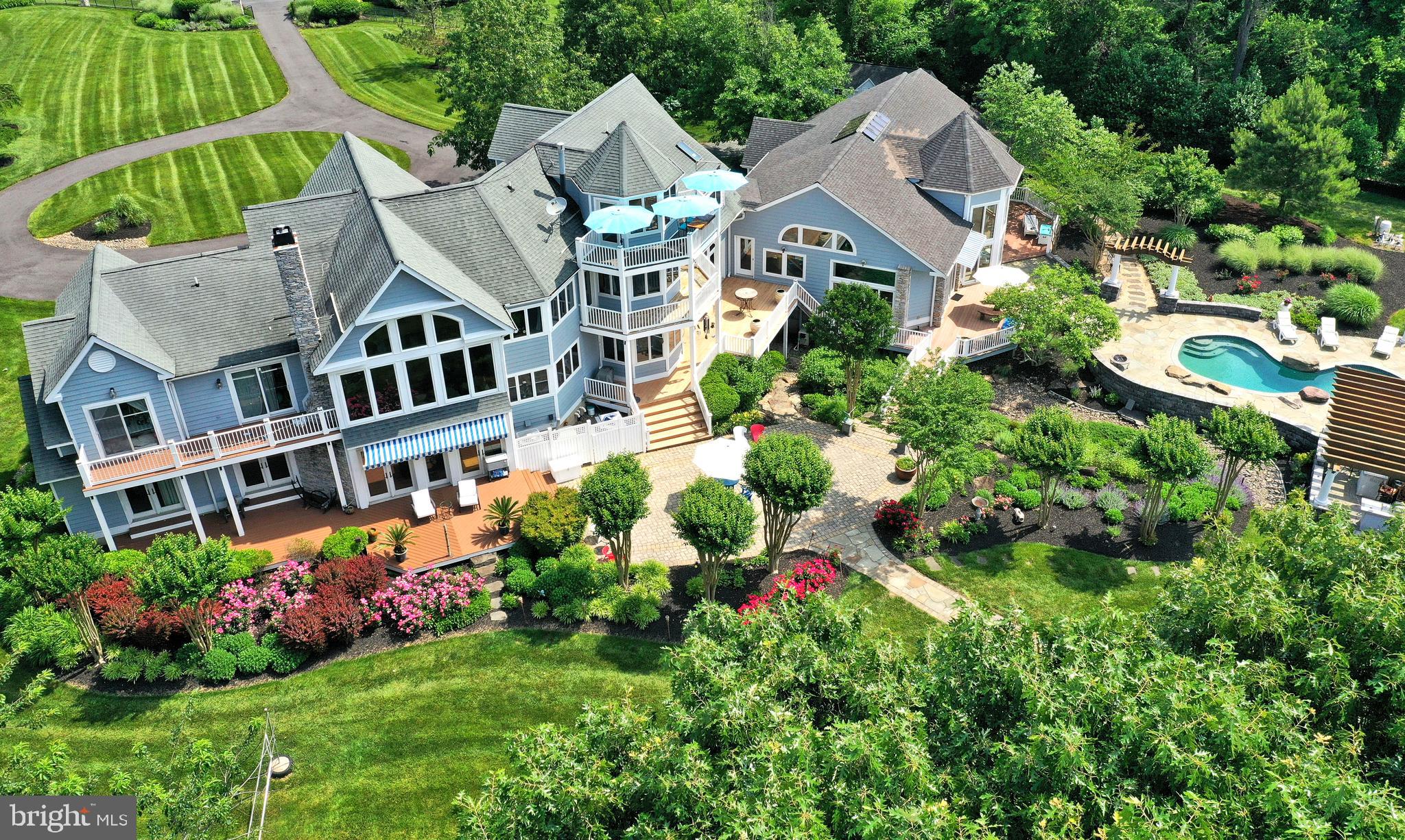 OVER 200,000.00 PRICE REDUCTION, SELLERS HAVE FOUND THEIR HOME OF CHOICE!!! Tour this beautiful home and fall in love with its beauty. Settlement within 60 days.DRONE VIDEO IS A MUST SEE COPY AND PASTE. OR LOOK FOR MOVIE CAMERA ICON AT THE TOP OF PAGE..328 Wye Harbor Drive is unquestionably one of the finest properties on the market today. This property features fabulous water views and is located in   the prestigious community of  Wye Harbor, a neighborhood with only 31 homes 24 of which enjoy the beautiful waterfront pleasures of the Wye River. The residence features a sunbathed contemporary open floor plan with views of the river from almost every room. This striking home offers over 8000sf of luxurious living space, 5 levels, 4 bedrooms all with water views , Gourmet Kitchen, 3 full and 2 half baths, multiple gathering areas, Indoor and Outdoor Pools, Billiard Room, Entertainment area with wet Bar, Wood Burning stove and walls of windows. The home carries the name of Windows on the Wye. The Master suite features a sitting room, gas fireplace, luxurious master bath with separate vanity, soaking tub, shower, large walk in closet and fabulous water views. More amenities in the home but to numerous to outline. The main house is completed by a footprint crawl space, perfect for storage.This is a Fabulous home for entertaining. Situated on 2.8 acres in a waterfront oasis. Sandy white beach, 690+ feet of shoreline, 5' MLW,  pier, lift and stunning landscaping with inviting custom patio s, pool and pergola/kitchen/bar.