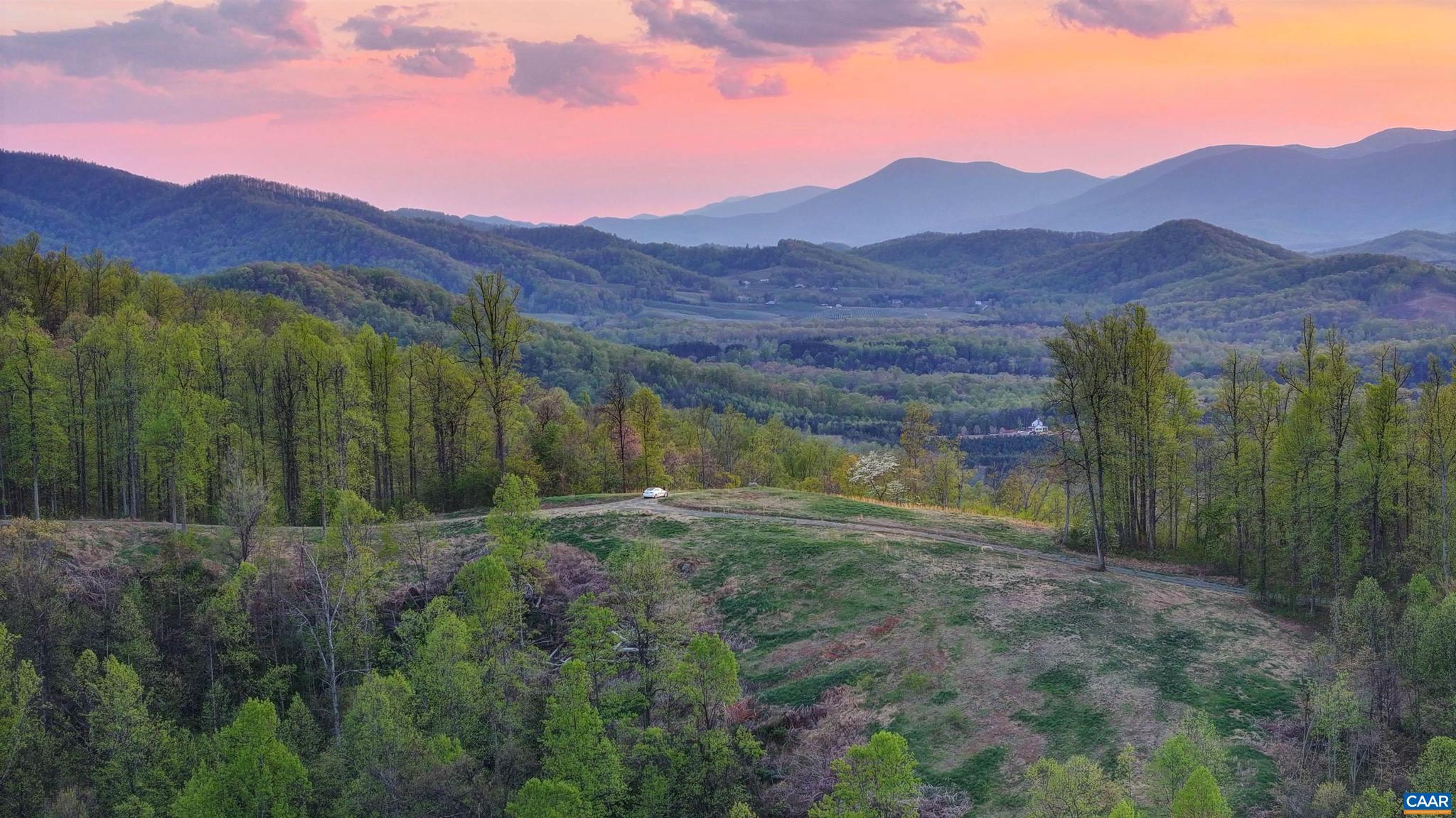 BACK UP Offers WELCOME !   EXTRAORDINARY PANORAMIC MOUNTAIN VIEWS sweeping from The Priest Mountain south of The Wintergreen Resort north to Greene and Madison Counties. Utterly magnificent !! This totally private 107 + acre mountain top is protected under a conservation easement and offers 2 division rights each allowing a main house and a dependency. Property features include a beautifully new pond, a stabilized chestnut cabin multiple stone chimneys rand other legacy features. The property starts at second unlocked red gate. Miles of trails including access to adjacent 2300 acre Bundoran Farm Trail system. There is an easy gravel driveway all the way up and electrical is buried half way up already.  This unequaled property awaits its' new steward. Please do not enter old cabin.,The Mountain Top