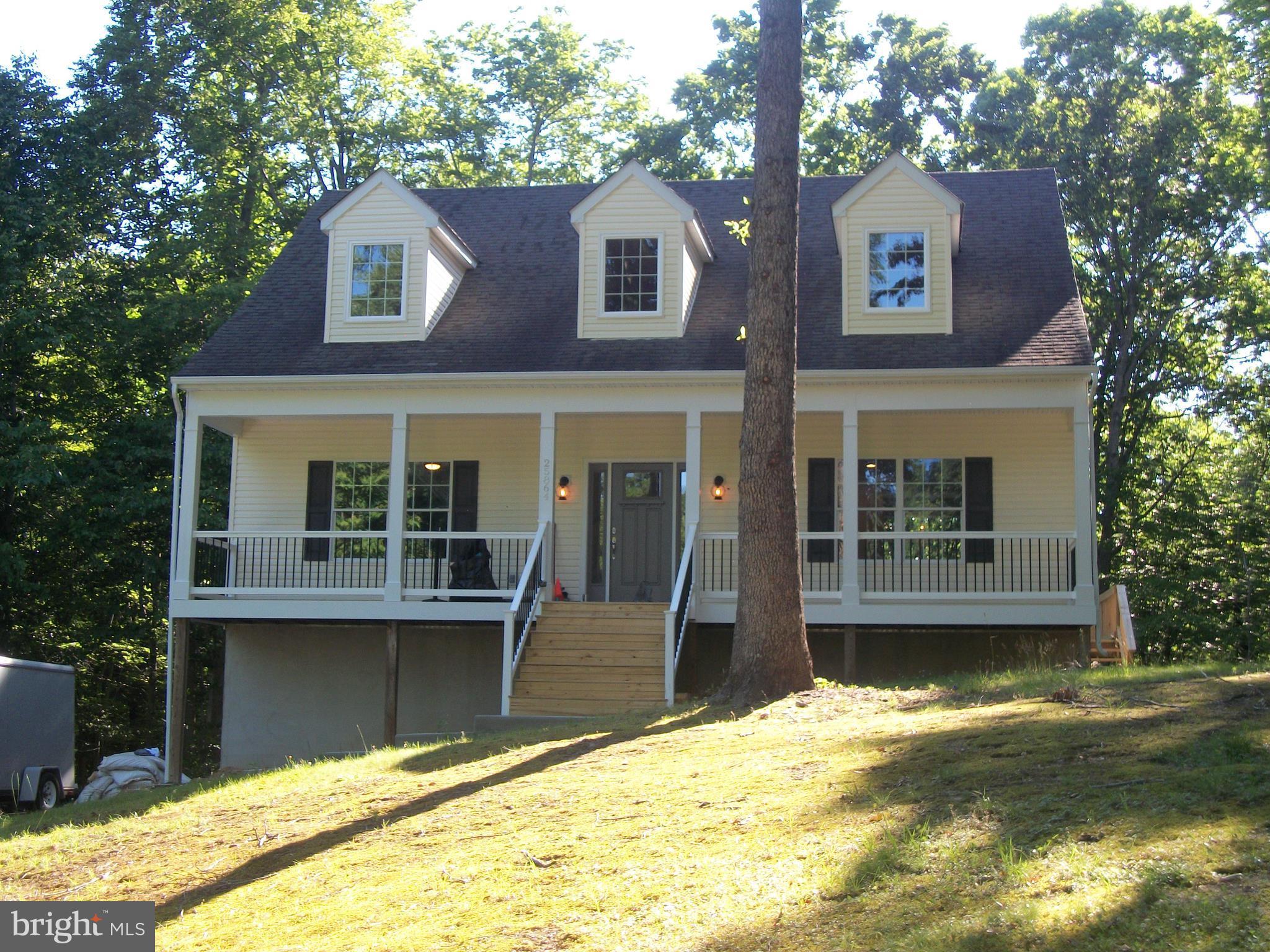 Wow!  EVERYTHING: NEW & BEAUTIFUL inside. TOP OF THE LINE. 4BR/3 Bath. 2 Large Master Suites w/walk-in closets. New DREAM KITCHEN. Concrete Counter and Vanity tops. Backs to woods. Large, private Deck. Shed. All 3 levels newly finished, with beautiful Hardwood and Tile. Gorgeous Stone Fire Place. You will be amazed! Great view from front porch. Beautiful 3.5 acres. NO HOA.
