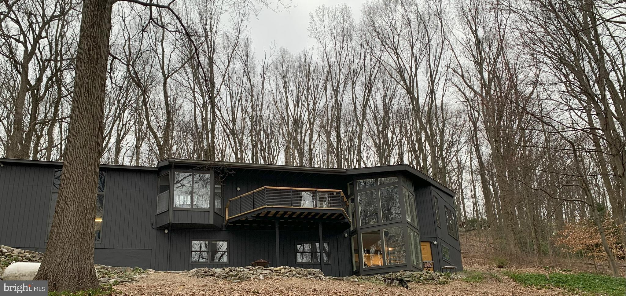An amazing opportunity to own this view of the spectacular and sought-after Valley Forge Mountain! This Paul L’Esperanza contemporary home is tucked away on a 5.4 acre lot. Enjoy privacy, the beauty of nature and serenity, all the while being minutes from the conveniences of suburbia. With over 3,400 square feet of living space, this home has had an amazing transformation to every room keeping the integrity of md-century throughout.  On the main floor, cathedral ceilings paired with lots of windows brings the outside in and the open concept floor plan is great for entertaining! A spacious new kitchen is complete with a central island, additional entertaining/breakfast island, and  a quaint breakfast nook overlooking the front yard through bay windows. Completing the main floor is the master bedroom and a master bath newly updated with a double vanity, a wall of windows and an open natural stone shower, finished with heated floor.  Descend the spiral staircase to the lower level where you'll find two more generously sized bedrooms, a full updated bathroom, laundry room and great room, including a pool table. A 2-car garage with finished loft storage space above is attached to the home. Convenient to all highways, this property is also minutes away from Valley Forge National Park and an abundance of local shopping and entertainment options. *Due diligence for possibility of subdividing would be necessary.  DO NOT DRIVE UP DRIVEWAY WITHOUT AN APPOINTMENT.