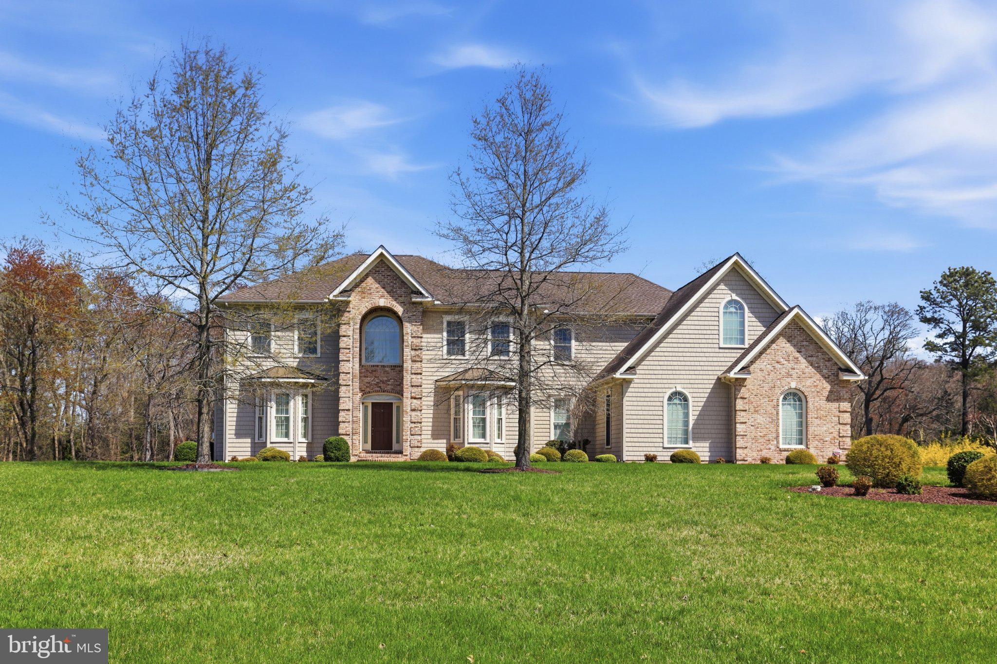 Nestled in the serene Haven Lake Estates, this exquisite manor-style residence offers a harmonious blend of luxury and comfort. Built in 2015, the home boasts a traditional architectural style with advanced construction materials, ensuring both elegance and durability. Step inside to discover a warm and inviting interior featuring solid hardwood floors, crown moldings, custom draperies and blinds, built in bookcases, elevator, Kitchen with every upgrade imaginable, and recessed lighting, and beautiful chandeliers and sconces throughout, that create an ambiance of sophistication. The gourmet kitchen, equipped with stainless steel appliances, a double oven, and a spacious island, is perfect for culinary enthusiasts. Enjoy cozy evenings in the family room, complete with a gas fireplace, or unwind in the luxurious primary suite featuring a soaking tub and walk-in shower. The exterior is equally impressive, with extensive hardscaping, lush landscaping, and a tranquil rear yard that backs to trees, providing a peaceful retreat. The property spans 1.3 acres, offering ample space for outdoor activities and relaxation. Enjoy the nearby Haven Lake, where fishing and canoeing await, enhancing your lifestyle with nature's beauty. With a two-car 28 x 32 garage and additional parking, convenience is at your fingertips. This home is not just a residence; it's a lifestyle choice, offering a perfect blend of luxury, comfort, and access to nature. Experience the exclusive charm of Haven Lake Estates today.