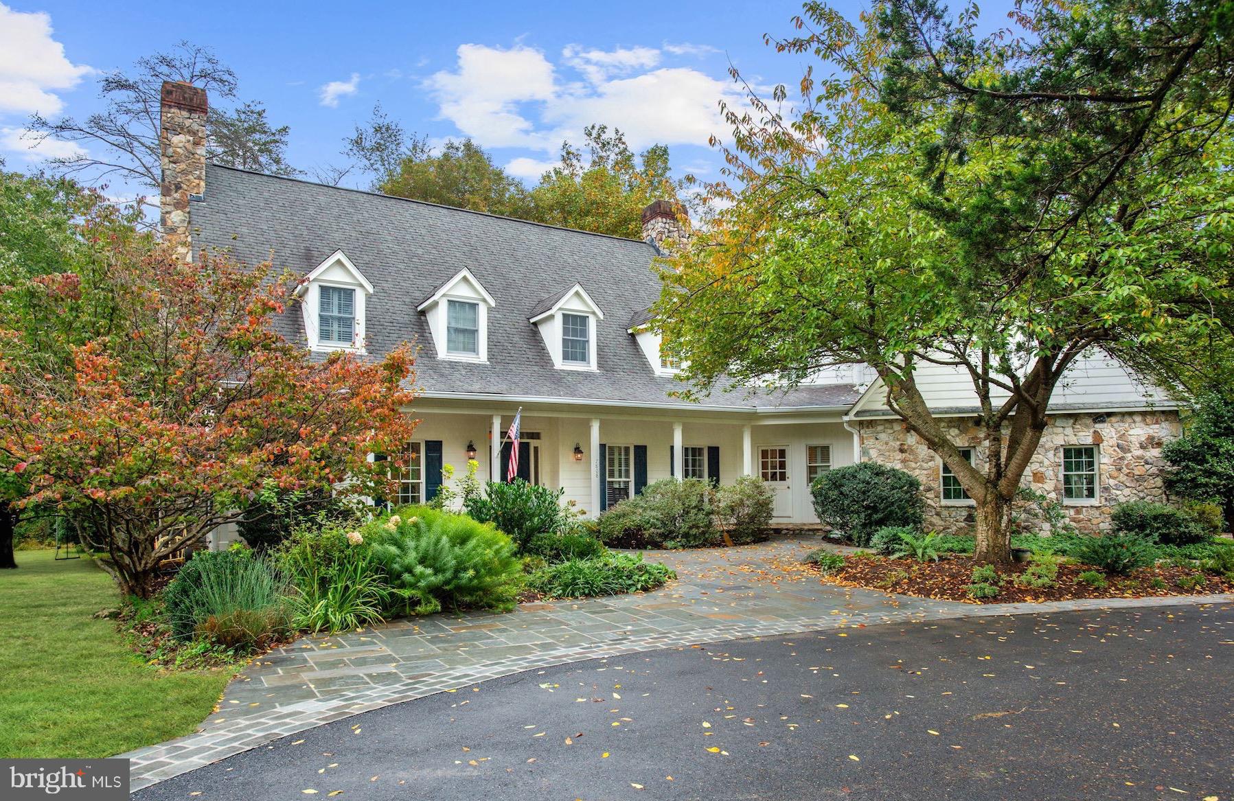 Welcome to 7808 Kachina Lane! Tucked away within a private enclave of homes, this rarely available home offers an idyllic retreat-like setting on two acres in an excellent Bethesda location.  Mature landscaping surrounds the property, offering pretty wooded views & a variety of trees. A beautiful flagstone walkway leads to the charming covered front porch with swing. Curved archways, hardwood floors, elevated ceilings, recessed lighting and crown molding throughout the main level. The stunning gourmet kitchen opens to the family room featuring dramatic floor-to-ceiling windows and vaulted ceiling. The kitchen has been impeccably remodeled with no detail overlooked; including 42-inch white wooden cabinetry,  top-of-the-line appliances, bead-board ceiling, pine flooring, designer tile backsplash, beautiful Mother of Pearl Quartzite countertops, and stainless steel sink with large window above overlooking the backyard. The center island hosts a prep sink and the peninsula offers counter-seating. A delightful table space has built-ins, plantation shutters, a window bench and wood-burning fireplace with beautiful stone-surround. Other features of the main level include an office with gas fireplace and attractive bookcases, two powder rooms, a mudroom which offers closets and access to the two-car garage with storage, shelving and work bench.   The distinctive owners suite features painted hardwood flooring, vaulted ceilings, decorative beams, and a gas fireplace with stone surround. The expansive owners bathroom hosts a dual sink vanity, huge shower with designer tile and dual shower heads, large soaking tub, walk-in closet, separate toilet room and additional closet space. New carpeting runs throughout the other four bedrooms on this level, including a vast room that could make a great playroom or exercise room. There are two hall bathrooms and an ideally located laundry room with utility sink on this level.  The new carpeting continues on the third level with two additional bedrooms, linen closet and gorgeously updated bathroom with floating sink and glass shower door. The lower level of the home is fully finished with walkout access to the backyard from the great recreation room with a fireplace. This level features new luxury vinyl tile flooring throughout and also hosts a remodeled full bathroom, game room, media room and storage space with shelving and wine closet.   A unique and remarkable floor plan, this home offers expansive yet charismatic spaces throughout. The location provides walkability to the elementary school, along with convenient access to Bethesda, Potomac, I-495, and more! Dont miss the opportunity to call this beautiful property home!  Offers if any due Tuesday at Noon