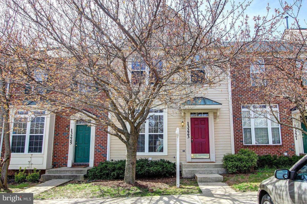 Lovely 3 BR + den, 3.5 BA TH. Huge center island, gourmet kitchen w/ stainless, granite, plenty of cabinet space. Open to dining, family rms.  HDWD main lvl. Owner suite, cathedral ceilings, BA ensuite sep soak tub. Fin. walkout lower lvl w/ den, rec rm w/ fpl, full BA. 2 lvl deck backs to trees. New carpet, fresh paint. Tot Lot, Pool. Walk to MARC, assigned parking. Home warranty. Nr shops, parks
