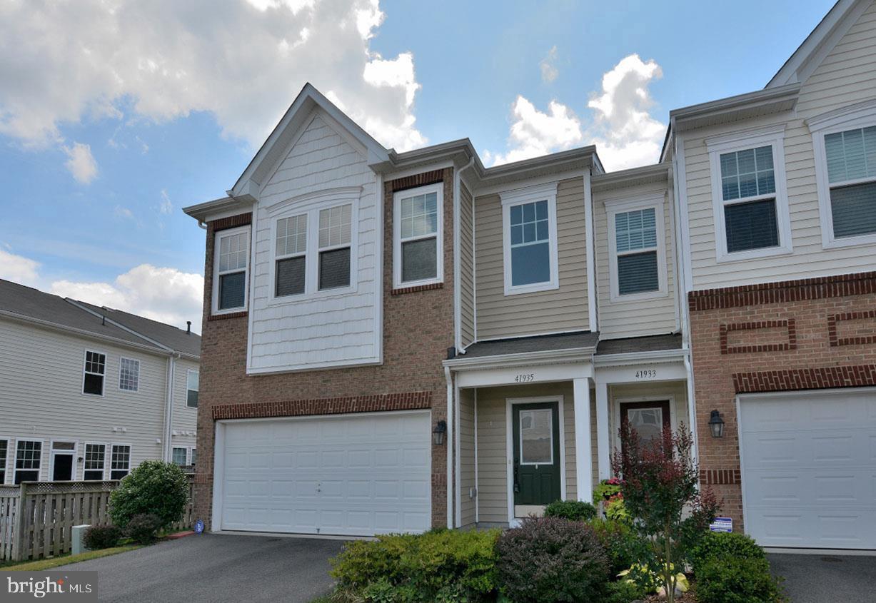**Welcome to this stunning Northeast-facing End Unit Villa in the highly sought-after Stone Ridge community, offering over 2,531 square feet of beautifully designed living space with 4 spacious bedrooms and 3 full bathrooms. **

Thoughtfully designed for comfort and flexibility, this exceptional home features a **rare main-level oversized bedroom with an adjacent JACK-N-JILL full bath**, ideal for guests, multigenerational living, or a private home office.

A charming, highly private front porch creates the perfect space to relax and enjoy every season. Inside, you'll be greeted by an open and airy floor plan enhanced by **engineered hardwood flooring throughout the entire main level**. The gourmet kitchen is a chef's delight, showcasing granite countertops, upgraded latest stainless steel appliances, contemporary cabinetry, and a spacious walk-in pantry.

The inviting family room opens to a private patio and fenced outdoor space, perfect for entertaining or unwinding. The elegant living and dining areas provide ample room for gatherings and everyday living.

Upstairs, the luxurious owner's suite offers a generous bedroom, an expansive walk-in closet, and a spa-inspired bath featuring dual vanities, and a large walk-in shower. Two additional spacious bedrooms share a convenient Jack-and-Jill bathroom, creating an ideal layout for family and guests.

The location is truly exceptional:

* Less than 0.2 miles from a clubhouse and swimming pool
* Access to **3 clubhouses, 3 community pools, a fitness center, scenic trails, and playgrounds**
* Approximately 1 minute to Park & Ride
* About 10 minutes to the Metro and airport
* Minutes to shopping, restaurants, hospitals, banks, and everyday conveniences
* Close proximity to the vibrant Brambleton Town Center

Enjoy resort-style amenities, outstanding convenience, and low-maintenance living in one of the area's most desirable communities. This exceptional home truly offers the perfect blend of luxury, comfort, and location.