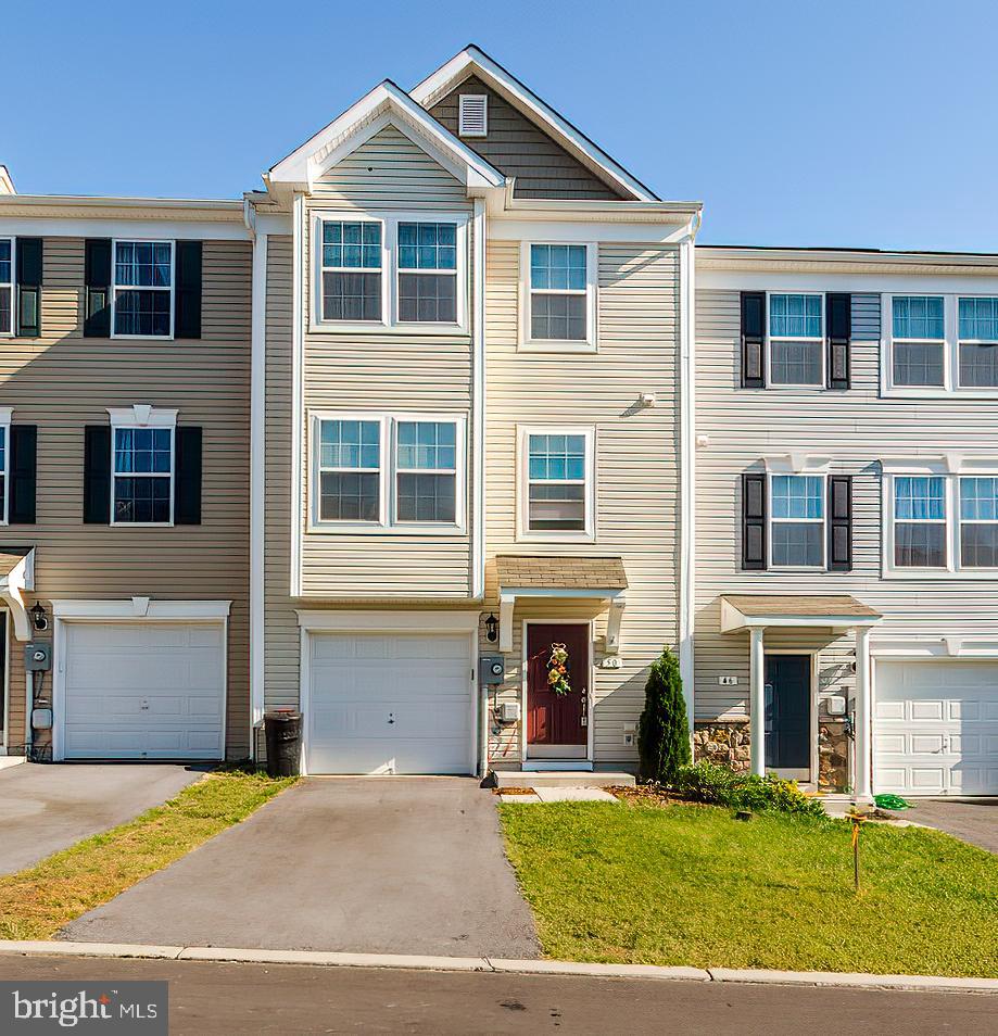 WHY WAIT TO BUILD- TOWNHOME IS ONLY 2 YRS OLD.  3 bedrooms, 2full bath and half bath on main level. Master  bath includes soaking tub and separate shower. Fenced rear yard, Large lower finished recreational room with a rough in bath. Call today to schedule your showing, Make this your NEW HOME!!