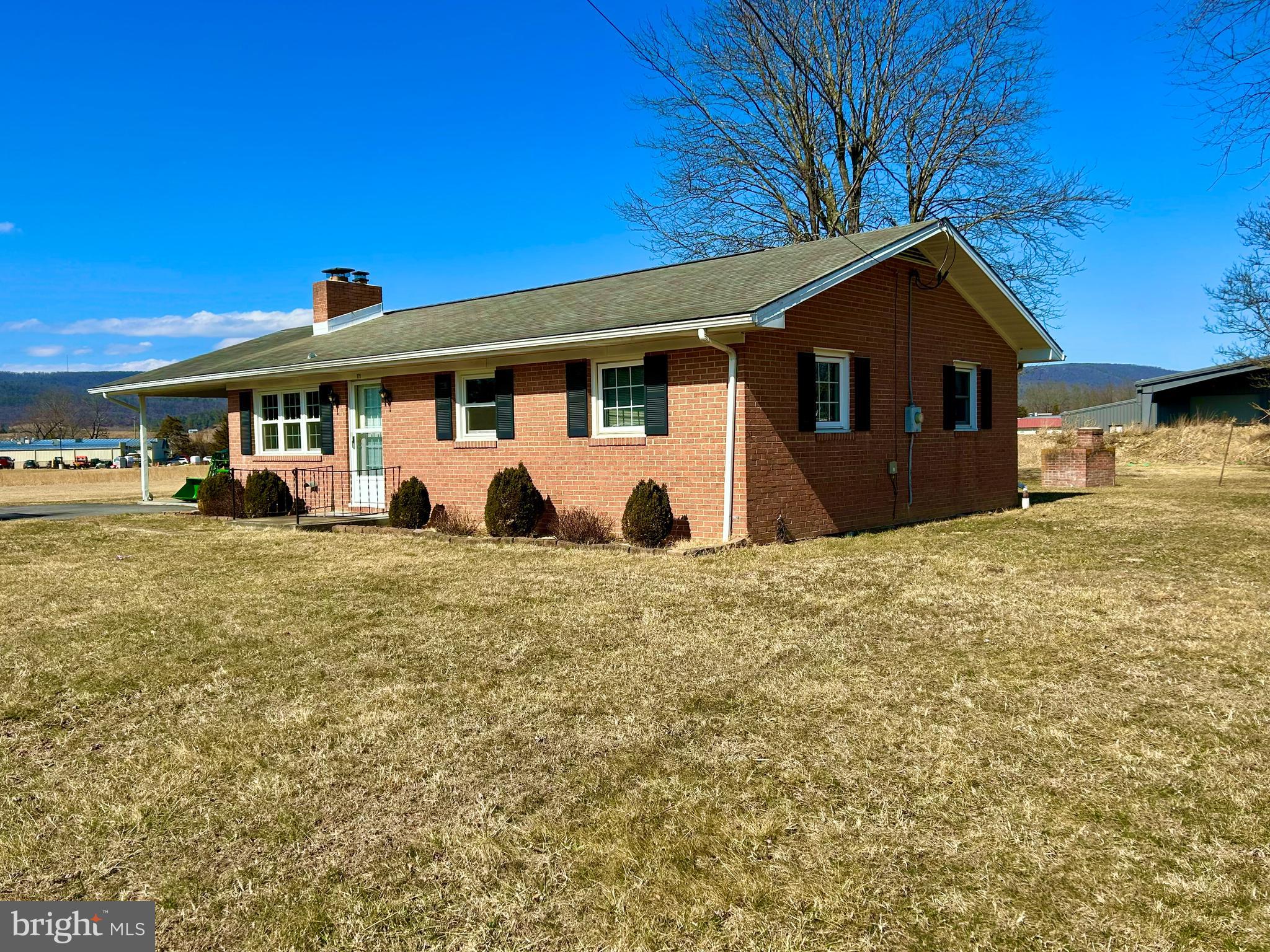 Charming 3-bedroom, 1-bath brick rancher situated on a full 1-acre lot in a quiet, convenient location just minutes from downtown Wardensville. This well-built home features beautiful hardwood floors throughout and a cozy brick fireplace in the living room, adding warmth and character to the main living space.

The full basement offers abundant storage, hobby space, or future expansion potential, and includes a wood stove—perfect for supplemental heat and added comfort during the colder months.

Outside, you’ll find a versatile storage building/workshop along with an additional utility shed—ideal for tools, equipment, or outdoor projects. The property is located right off state-maintained roads, providing reliable year-round access, even in winter months.

Enjoy peaceful country living with quick access to town amenities—an ideal blend of privacy, comfort, and practicality.