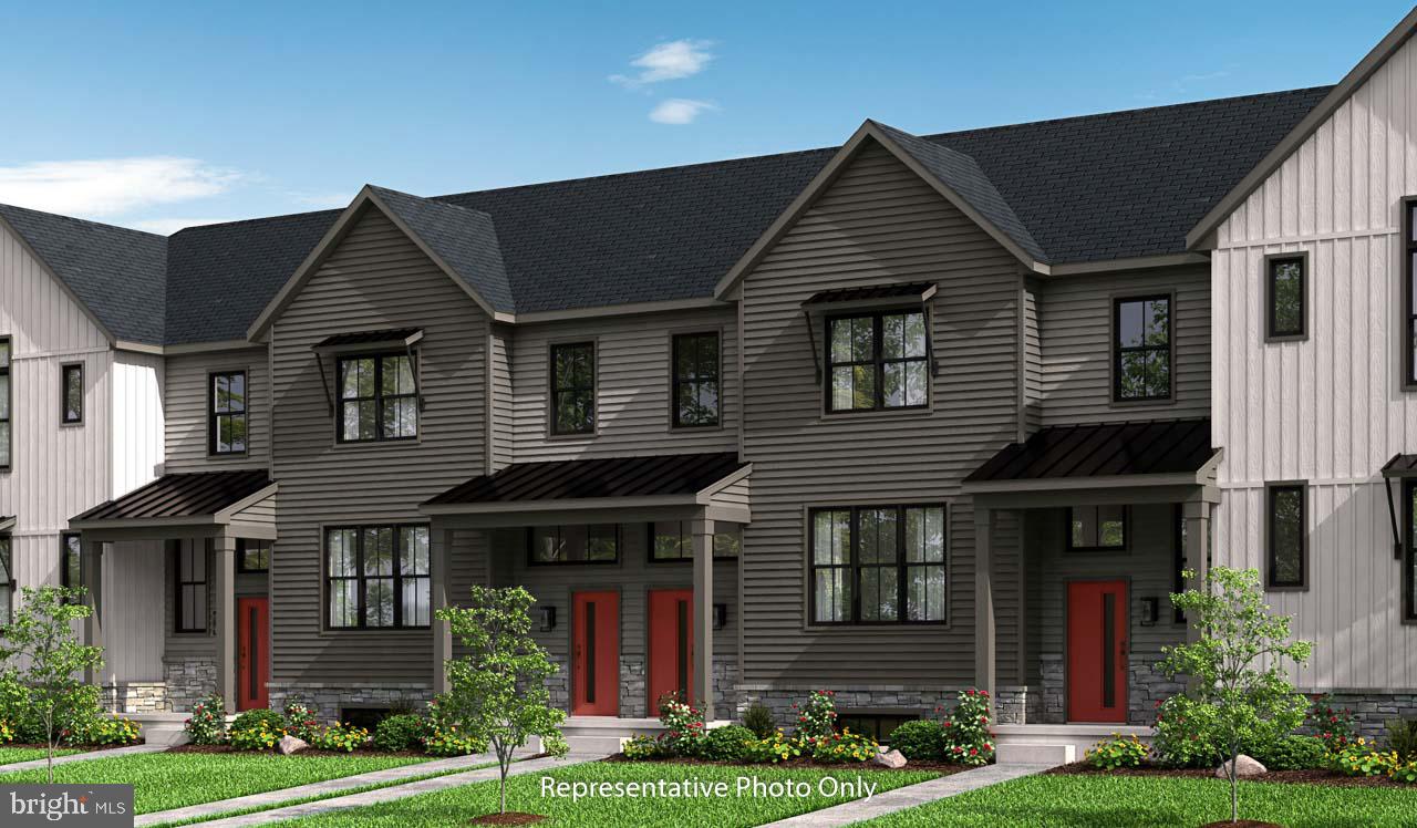 This 2-story townhome includes a 1-car, rear load garage with mudroom entry, and a patio for outdoor living. The first floor boasts 9’ ceilings and a kitchen with stainless steel appliances, attractive cabinetry, and quartz countertops with tile backsplash. The kitchen opens to the spacious dining area and sunny living room. All 3 bedrooms, 2 full bathrooms, and a convenient laundry room are located on the second floor. The owner’s suite features an expansive closet, and the private bathroom has a double bowl vanity and 5’ shower.