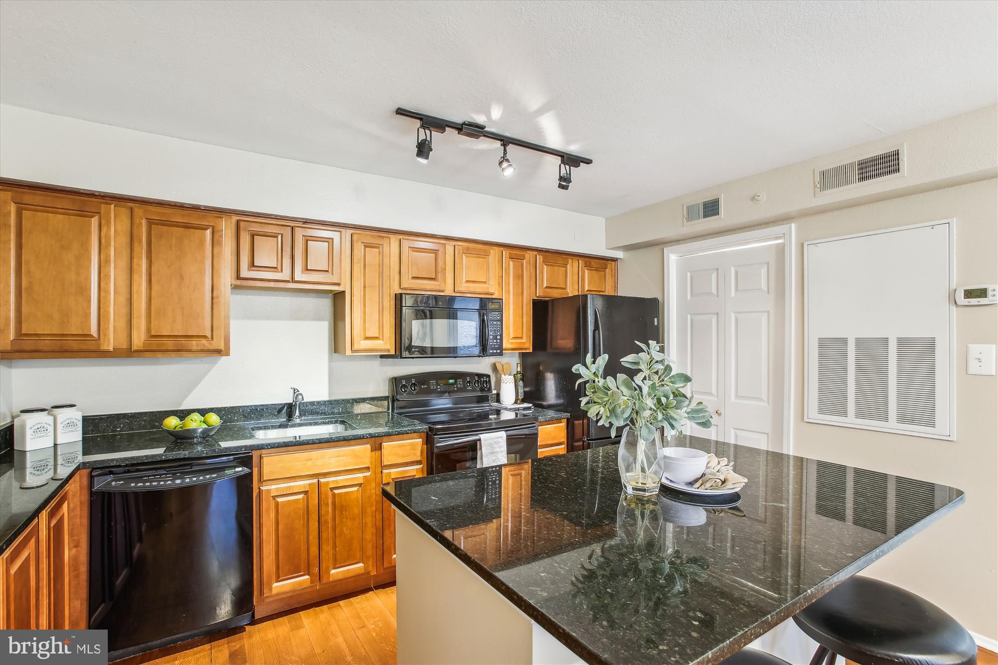 Commuters Dream with easy access to route 7 and one light to 395  or better yet take the daily shuttle to the  Pentagon metro.  So,  why rent when you can buy this nicely appointed 1 bedroom, 1 bath condo at the Pointe at Park Center - gated community in Alexandria.  This quaint condo has everything you need to make yourself at home - rich looking cabinets with black granite counters and matching appliances.   Amenities galore - pool, fitness center and community room are just a few steps away.  Dedicated parking space, great view of the pool from the private balcony and lots of shopping and restaurants nearby.   Open House Sunday 1/28 2 pm - 4 pm.  Stop by.
