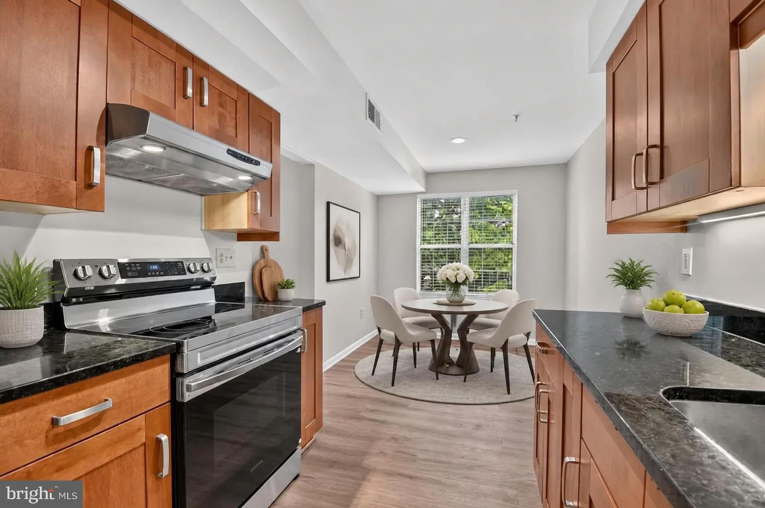 Welcome to this beautifully renovated 2-bedroom, 2-bath condominium offering stylish updates and comfortable living throughout. The home features brand-new luxury vinyl plank flooring with an enhanced sound barrier for added comfort and privacy, along with fresh paint and updated lighting fixtures that create a bright, modern atmosphere. The remodeled kitchen is designed to impress with granite countertops, stainless steel appliances, a new 5-burner range, and a new refrigerator. Both bathrooms have been refreshed with new vanities, mirrors, and fixtures, while new blinds throughout the home provide a clean, contemporary finish. Additional peace of mind comes from the HVAC system, which was replaced in 2024. Residents enjoy an array of community amenities, including an outdoor swimming pool, tennis/pickleball courts, community center, and expansive green spaces. Ideally located near shopping, restaurants, entertainment, and major commuter routes, including the ICC, this move-in-ready home offers the perfect combination of convenience, comfort, and value. Don't miss this exceptional opportunity!
