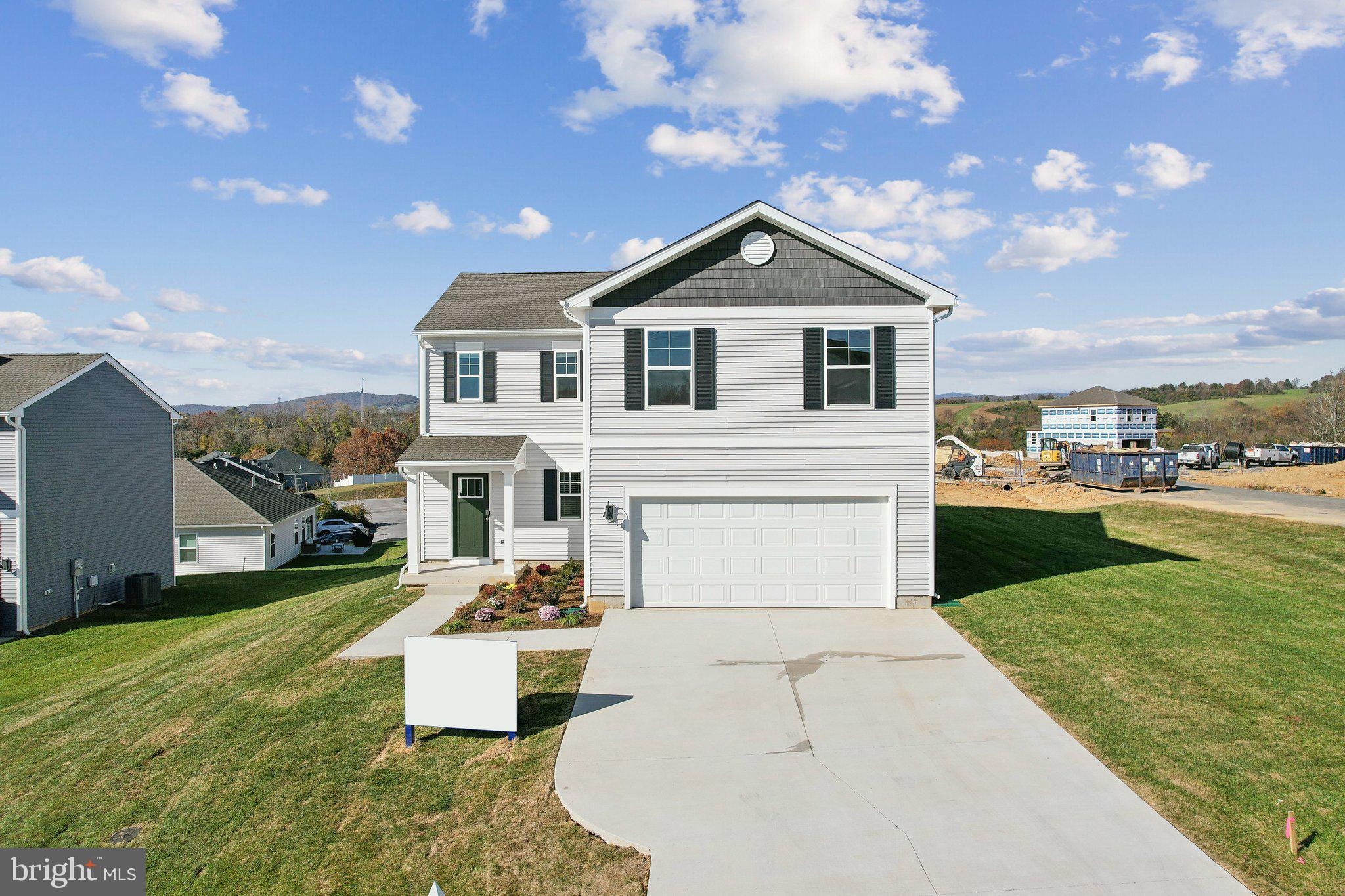 Welcome to this stunning, move in ready 4-bedroom, 2.5-bath home with 2,237 square feet of stylish living space on three levels. The home features a very open floorplan that seamlessly connects the spacious kitchen, dining, and living areas, creating an ideal space for entertaining and daily living. The impressive primary bedroom offers a large walk-in closet, offering ample space to organize and display your wardrobe. The three additional bedrooms are spacious, and the two and a half baths are expertly designed for maximum comfort and convenience. This home features a walk-out basement which offers a perfect blend of finished and unfinished space. The beautifully finished recreation area provides ample room for entertainment, relaxation, or a home gym. Adjacent to the recreation space, you'll find a generous unfinished storage area, ideal for keeping your home organized and clutter-free. Additionally, the basement is roughed in for a bathroom, giving you the flexibility to add a full or half bath to suit your needs. This space is full of potential and ready to be customized to your lifestyle. With a two-car garage and thoughtfully designed features, this home is perfect for modern living and is ready to welcome you!
