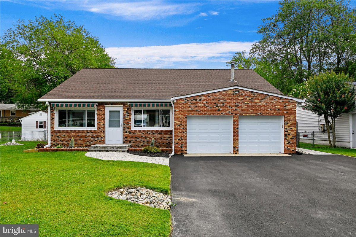 Nestled in the charming water privileged community of Woodland Beach, this delightful ranch-style home, with tremendous curb appeal, offers a perfect blend of comfort with single-level living. Built in 1930 and thoughtfully renovated with a new roofline in 2000, this residence features three bedrooms and a well-appointed full bathroom, making it an ideal retreat for those seeking a cozy atmosphere. There have been many newer updates and upgrades, too many to mention here, but are listed with the disclosures. The heart of the home boasts a functional kitchen equipped with essential appliances, including a propane gas oven/range, brand new refrigerator, and free standing microwave. The inviting layout includes an enclosed side porch and provides ample space for relaxation and gatherings. Set on a generous 8,000 square foot lot, the well manicured property includes a quaint paved patio seating area in the rear and a large side yard. The property includes a large shed/shop with electric (approx 12'x24'). A convenient and coveted attached 2-car garage with a wide paved driveway will accommodate parking for up to six vehicles. Enjoy the serene beauty of the South River and leisurely afternoons on any one of the community's five beaches. The Woodland Beach community is known for its friendly atmosphere and strong sense of belonging. Residents benefit from nearby shopping, restaurants, a county library, and so much more. Local schools are within easy reach and with its combination of modern amenities, community spirit, and proximity to nature, this home is not just a place to live-it's a place to thrive. Experience the warmth and comfort of Woodland Beach, where every day feels like a getaway.