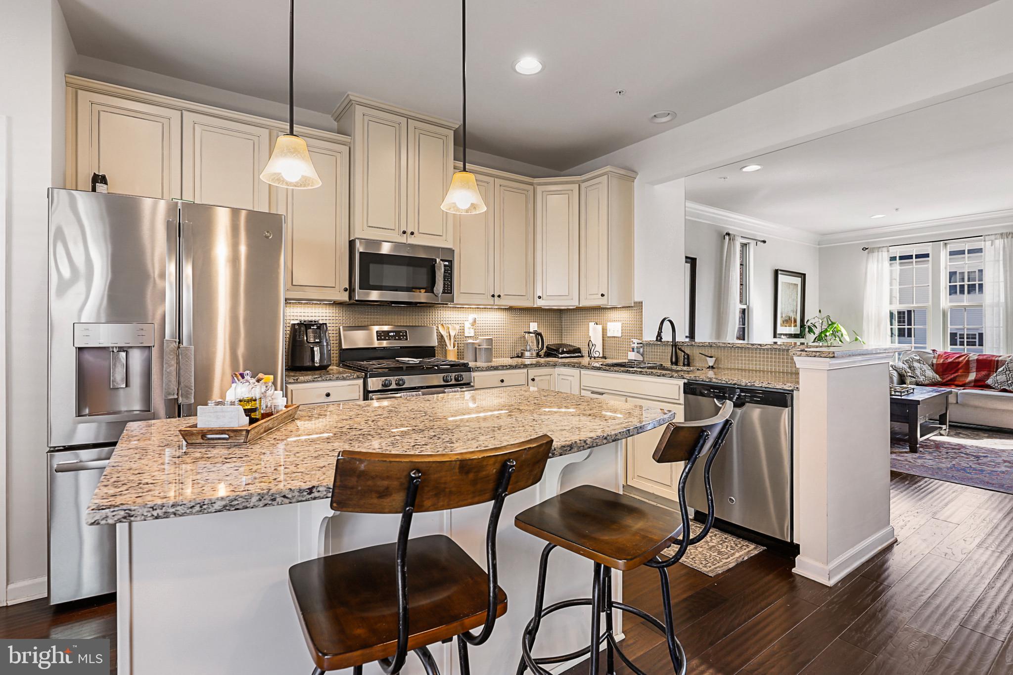 Welcome to your ideal living space, a remarkable 5-year-old end unit townhome constructed by Ryan Homes. This impeccably maintained property offers an array of impressive upgrades throughout. Nestled in a fantastic community complete with a pool and clubhouse, this home provides you with an exceptional living experience.

Key Features:

1. Exceptional Flooring: As you enter, you'll be greeted by gleaming hardwood floors that adorn the stairs and extend throughout 100% of the second floor. These high-quality floors lend an air of elegance and durability to your home.

2. Two-Car Garage: Convenience is at your fingertips with a spacious two-car garage, providing ample space for parking and storage.

3. Outdoor Bliss: Enjoy your morning coffee or evening sunsets on the inviting composite deck, the perfect space for relaxation and outdoor entertaining.

4. Modern Kitchen: The kitchen is a chef's delight, boasting a generous island, sleek stainless steel appliances, and exquisite cabinetry that complements the overall aesthetic of the home.

5. Illuminating Details: Recessed lighting has been thoughtfully installed on the first, second, and third floors, ensuring a bright and welcoming ambiance.

6. Stunning Exterior: The full brick front gives this townhome a distinguished and timeless appearance, making it stand out in the community.

7. Extra Space: Situated on a larger lot due to its end unit positioning, this townhome offers more outdoor space for various activities and landscaping possibilities.

8. Upgraded Bathrooms: The bathrooms have been thoughtfully upgraded to match the quality and style of the kitchen. Featuring upgraded countertops, cabinets, and elegant floor and tile choices, they offer a spa-like experience.

This townhome is an embodiment of comfort, style, and quality. With its top-notch finishes, an abundance of natural light, and an array of contemporary features, you'll find the perfect balance between luxury and functionality.

Located in a vibrant community with a pool and clubhouse, you can relish in the convenience of easy access to recreational amenities and a close-knit neighborhood. If you're looking for the perfect blend of modern living and comfort, this townhome is your answer.

Don't miss the opportunity to make this your forever home. Contact us today to schedule a viewing and experience the allure of this exceptional property in person. Your dream home awaits!