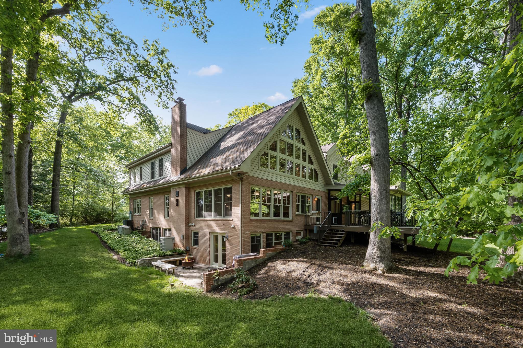 This stunningly beautiful private craftsman settled on over one and a half acres of landscaped grounds in the Quaint Acres community of Montgomery County! Arrive through the stone front porch or the oversized two car garage and experience an open concept floor plan featuring gorgeous custom updates, soaring two story ceilings, and sophisticated designs! The foyer with warm golden hardwood floors guides you into the living room adorned by a custom built-in entertainment center and a brick exterior wood burning fireplace for those cool evening spending time with loved ones. Let the gourmet kitchen provide a stellar atmosphere to create delicious morsels boasting a breakfast bar, rich 42” soft close Quantson Oak cabinetry with pull out drawers, stainless steel appliances, and granite counters. Relax and unwind in the primary bedroom suite featuring cathedral and vaulted style ceilings, a sitting area for reading, a walk-in closet with custom organizing system, and an en-suite highlighted by a jetted soaking, a glass door walk in shower, stained glass, and a double vanity that provides a tranquil retreat. Two additional bedrooms with walk-in closets and a dual entry bath complete the upper level sleeping quarters. The impressive loft offers an abundance of possibilities as an office, den area, or a lounge with spectacular views, through the picture  Eagle windows of the mature trees and main level living room. Opportunities are boundless in the entry level bedroom suite as a guest suite with a ceramic tile roll in shower, vanity modifications, and a plethora of storage space.  A fully finished lower level is ideal for a game, fitness, or recreation room with a full bath and access to the brick patio. Enjoy morning coffee, tea, or evening cocktails in the four seasons sunroom with a stove and Wolf decking, and access to the deck.  INVISIBLE DOG FENCE.  1.68 WOODED ACRES. A whole house generator, in-home speakers and intercom system, lawn sprinklers with 13 zones, and a 50 year guaranteed roof conclude this must-see property! Major commuter routes include MD-200, US-29, and I-495. Updates: Hot Water Heaters, Furnace, Heat Pump, Main Level Baths.