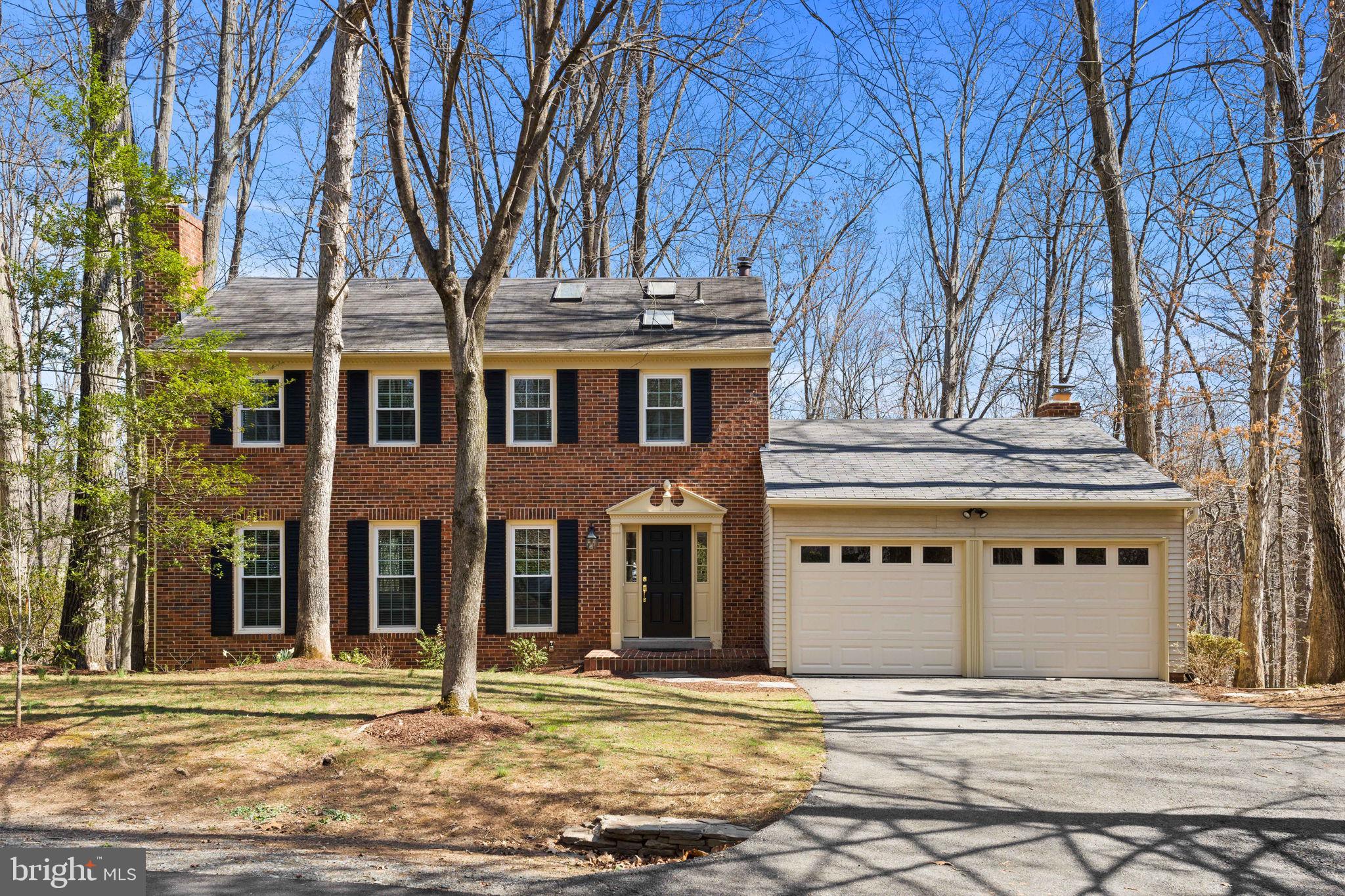 Welcome home to Reston! This lovely three-story colonial home boasts a recently remodeled kitchen, primary bedroom suite with its own private sitting room, stunning skylights, and a peaceful screened-in porch! Beautiful hardwood floors greet you at the entrance and lead you into the spacious living room. Continue into the adjacent dining room and you’ll find an elegant space for entertaining, with a stunning bay window and sophisticated chair rail molding. The kitchen has been beautifully renovated with sleek granite countertops, a ceramic tile backsplash, and brand new stainless steel appliances, and a peninsula bar. Enjoy a casual meal in the bright breakfast nook, surrounded by floor-to-ceiling windows. The kitchen opens directly into the cozy family room, featuring a classic brick fireplace, impressive skylights, and a wall of windows flooding the space with natural light. Plush carpeting leads you upstairs to the expansive primary bedroom suite, boasting a large closet and a private sitting room for peace and quiet after a long day. The generously-sized en suite bathroom is bathed with natural light from the skylight above, and features a step-in shower and soothing soaking tub, as well as a wide vanity with plenty of storage. Both additional bedrooms include soft carpeting and wide carpeting, with shared access to the second full bathroom in the hallway. For the height of convenience, laundry is located on the bedroom level. Downstairs, the lower level offers several versatile spaces with a massive recreation room and plenty of convenient storage. With the fourth bedroom and third full bathroom on this level, this could be a perfect private space for guests to lay their head. On the back of the home, enjoy the peaceful, tree-lined backyard from your amazing screened-in porch, or entertain and grill on your large wooden deck, with mature trees providing both privacy and shade. The two-car garage and driveway offer you additional storage and plenty of parking. Major updates to the home include new windows (2022). Backing to the W&OD Trail and just off the Cross County Trail, outdoor enthusiasts can easily access the abundance of nature that surrounds you. Enjoy the multitude of amenities offered by the Reston Association, including outdoor pools, tennis courts, playgrounds, sports fields, and trails. This convenient location is just minutes to Safeway, Whole Foods, Reston Town Center, Reston Community Center, Lake Fairfax, Lake Anne, Meadowlark Botanical Gardens, Reston Hospital Center, and Dulles Airport. Quick access to Dulles Access Road, Fairfax County Parkway, I-495, I-66, and Wiehle Metro Station allows you to commute or travel around Northern Virginia with ease. Don’t miss out on this opportunity! Schedule a private tour of your new home today!