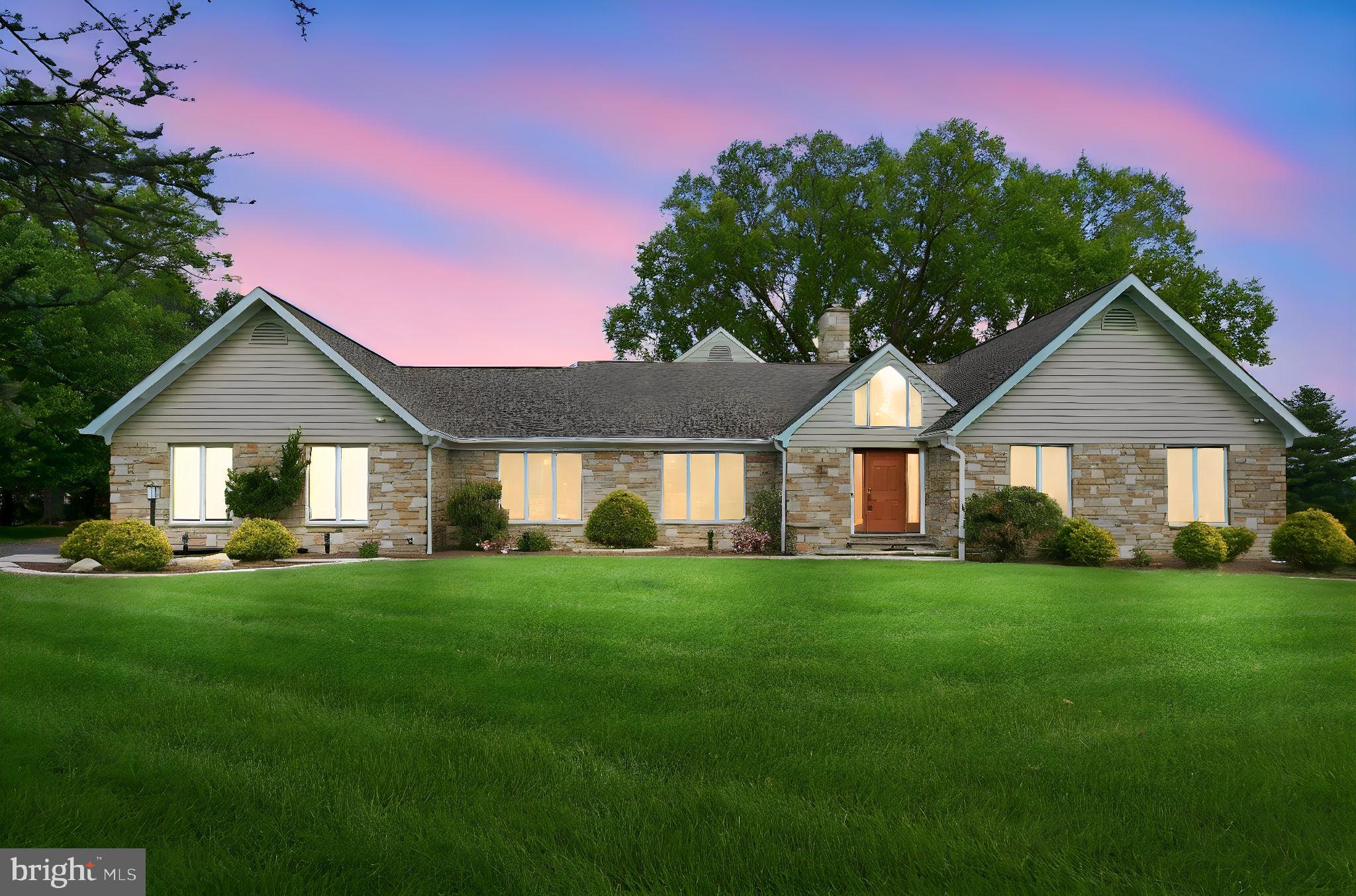 Situated in the highly sought-after Todd Lakes community, 1305 Lundy Lane presents a rare opportunity to own a custom-built luxury estate on one of the premier lots in the neighborhood. Positioned on a picturesque 1.5-acre corner lot adjacent to a quiet cul-de-sac, this exceptional 6-bedroom, 4 full and 1 half bath residence offers privacy, craftsmanship, and breathtaking water views overlooking one of the community’s serene lakes.

Designed with both scale and comfort in mind, this expansive home features soaring ceilings, oversized windows, marble tile entry, rich oak hardwood flooring, and remarkable natural light throughout. The main level includes a spacious primary suite, private office, formal living and dining rooms, and an impressive great room anchored by a dramatic natural stone fireplace with cast iron pellet stove. A stunning four-seasons sunroom with Travertine flooring, exposed stone accents, and panoramic lake views creates the perfect year-round retreat. 

The gourmet kitchen is equipped with Viking appliances, induction cooktop, custom real wood cabinetry, expansive countertops, LED lighting, oversized stainless sink, and seamless access to the massive rear patio—ideal for entertaining while overlooking the beautifully manicured grounds and water views.

The luxurious main-level primary suite offers a spa-inspired bath with marble and glass tile finishes, mosaic pebble flooring, Hansgrohe waterfall shower system, heated towel rack, soaking tub, walk-in closet with custom built-ins, and tranquil views of the patio, lawn, and lake. Additional bedrooms provide exceptional flexibility, including a dramatic two-story bedroom with spiral staircase and loft, plus an expansive upper-level suite perfect for guests, recreation, or multigenerational living.

Built with exceptional quality and enduring materials, the home showcases full stone exterior construction, steel I-beam floor support, Anderson windows and doors, three-zone high-efficiency HVAC, dual Marathon water heaters, ADT security system, and extensive storage throughout including a massive walk-up attic with reinforced flooring.

Outdoor living is equally impressive with mature landscaping, professional lawn care, and an expansive rear patio shaded by established trees, creating a private setting for entertaining, relaxing, and enjoying the natural beauty of Todd Lakes. Conveniently located near downtown Bel Air, shopping, dining, commuter routes, and top-rated schools, this one-of-a-kind luxury property combines timeless craftsmanship, architectural character, and an unmatched setting.