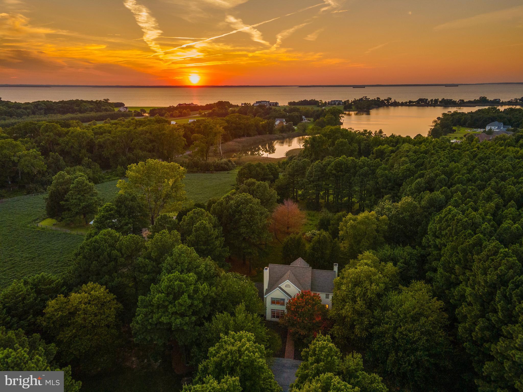 🌳 Huge Price Improvement! Welcome to the FUNNY FARM on 15 Acres of Kent Island Bliss! Good luck trying to find a home on Kent Island with 2+ acres of land, much less 15 acres! This is truly a one of a kind property, surrounded by multi million dollar estates.


Formerly a horse farm, this property boasts close to a mile of fencing, offering the potential for a seamless conversion back to a horse farm if your heart desires.

Home Highlights:

    🏡 Custom-built residence with nearly 4,000 sq/ft of living space.
    🔥 Two cozy fireplaces to warm your evenings.
    🛏️ First-floor primary suite with ensuite bathroom and in-law kitchenette.
    🚗 Attached 2-car garage for convenience.
    🌅 Second-story primary suite with a 3-story loft space.
    🛁 3.5 full baths for comfort and convenience.
    ✨ Two-story foyer for a grand entrance.
    🍽️ Stone patio and a screened-in porch for outdoor enjoyment.

Waterfront Oasis:

This property is a private waterfront oasis and a sportsman's paradise. Enjoy breathtaking sunsets over Northwest Creek, with 450 feet of waterfront for paddleboarding and kayaking. 


Recent Upgrades:

In the last 5 years, the property has received many upgrades, including hardwood floors, lighting, plumbing fixtures, major appliances, a whole-house water filtration and softener system, new gutters, well pump, fresh professional paint, custom window treatments, instant tankless propane hot water heater, and an owned propane tank with the option to convert the wood-burning fireplace.


Garage and Workshop:

The completely rebuilt "barn" has been transformed into a working garage, featuring 6 strategically placed garage doors for a refreshing breeze while you work. This space accommodates 5 vehicles easily, making it a dream for car collectors, with additional storage available in the run-in shed.

Location:

Experience the tranquility of this private retreat while enjoying the convenience of being the first exit across the Bay Bridge, just 9 miles from Route 50. With a straight shot to Annapolis, DC, NOVA, BWI, and Baltimore, you'll enjoy both privacy and accessibility.


Additional Zoning Information:

This extraordinary property is zoned Countryside (CS) by the county, offering a myriad of possibilities for its use. For detailed information on the permissible uses, please refer to the Queen Anne's County website.

Agricultural Benefits:

Presently, 6 acres of the property are actively farmed, not only contributing to the pastoral charm but also resulting in substantial tax savings through Agricultural use. Embrace the financial advantages of this arrangement while enjoying the scenic beauty and potential of your own working acreage.

Explore the diverse opportunities this zoning provides, visit the Queen Anne's County website or consult with local authorities to turn your vision for this property into a reality.


Don't miss out on this unique opportunity to own a piece of Kent Island paradise. Schedule your private viewing today! 🏡🌅