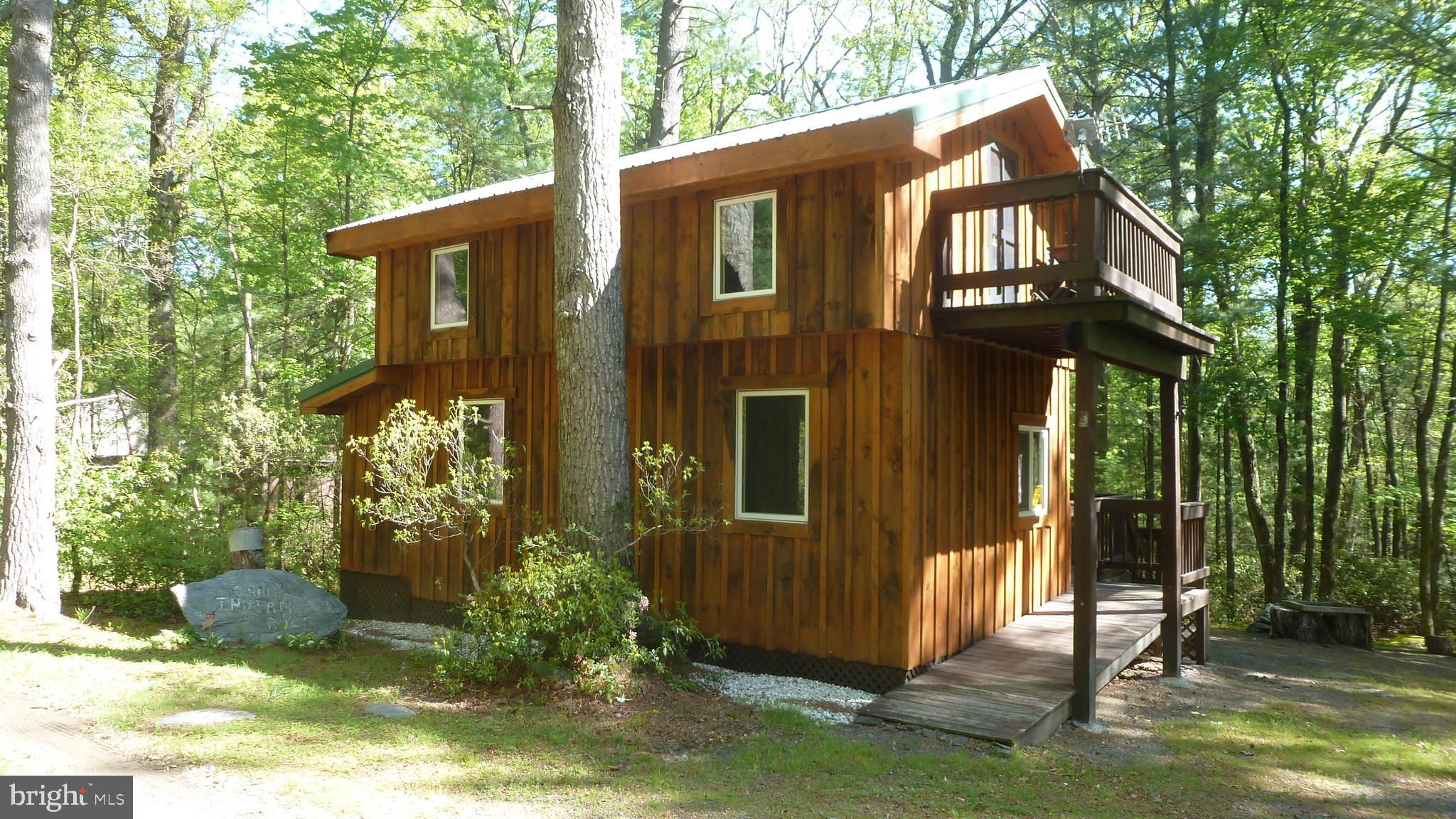 THE PERFECT HUNTING CAMP! Conveniently positioned between Caledonia State Park and Pine Grove State Park, and just STEPS from the 85,500-acre Michaux State Forest! PA RESIDENCY NOT REQUIRED! This recently built (2010-2012) 2-story cabin getaway is turn-key and ready for spring, summer and fall adventures in the forest!  First floor features an open room with living area, bar area and refrigerator. Large second floor bedroom with balcony.  There is an enclosed outdoor shower with gravity fed water from a 5 gallon reservoir located in the upstairs bedroom. Clean outhouse with gravity fed sink.  Shed and expansive outdoor cooking area! Lots of possibilities for upgrades here! Electric BB heat - no well - metal roof.  Peaceful wooded surroundings highlighted by beautiful mountain laurel. Whether you're looking for a weekend get-a-way or hunting cabin, this one is completely furnished (furniture & contents convey) and ready to go! Close to hiking trails, biking, hunting, fishing, and even golfing! A short drive will take you to historic Gettysburg, where rich history and charming shops await. Explore the beauty of Pine Grove Furnace State Park, Laurel Lake, Fuller Lake, Long Pine Run Reservoir, and the renowned Penn National Golf Course. Carlisle, Shippensburg and Chambersburg are also close by! This cabin sits on PRIVATE leased ground, providing a unique opportunity for affordable ownership. The lease total is $3,000 - paid $600 per year for 5 years. Then lease is renewed for another 5 years. These private leases date back several generations in the Irvin family. Cash sales only - leased land cabins cannot be financed.  Quick close possible!