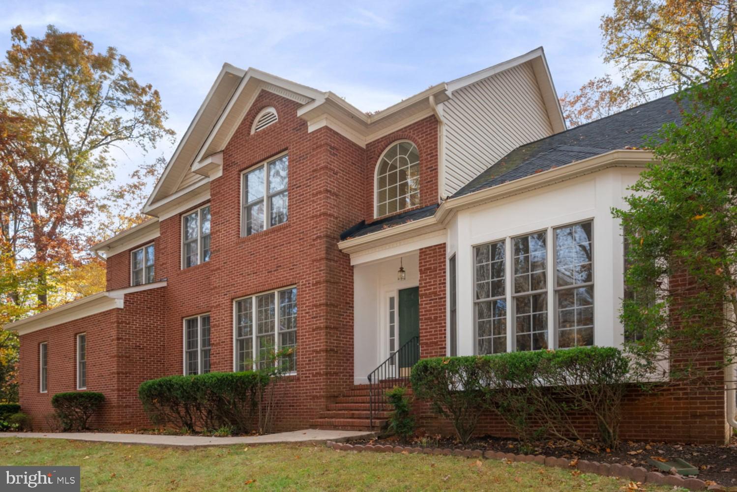 ** Sellers have an assumable VA loan with 2.25% interest rate** Nestled on three private, wooded acres in the sought after Seven Lakes community, this stately brick Colonial offers a rare blend of space, comfort, and natural surroundings just minutes from shopping, dining, and I-95.

Inside, the home features over 5,200 total square feet across three levels. A grand two-story foyer opens to formal living and dining spaces filled with natural light, while a main-level office with built-ins provides a functional work-from-home retreat. The spacious family room centers around a gas fireplace and offers direct access to the rear deck.

The kitchen is equipped with granite countertops, gas cooking, a double wall oven, center island, and a pantry, with an adjoining breakfast area that flows seamlessly to the composite deck—ideal for everyday living and outdoor enjoyment.

Upstairs, the primary suite includes a tray ceiling, two walk-in closets, and a private bath with soaking tub, separate shower, and dual vanities. Additional bedrooms are well-sized and served by full baths.

The finished walk-out lower level expands the living space with a large recreation room, wet bar, full bath, and additional bedroom, along with flexible space for a variety of uses.

Outdoors, the wooded setting provides privacy and a peaceful backdrop, complemented by a composite deck, paver patio, and storage shed.

Set within one of North Stafford’s most desirable communities, Seven Lakes offers walking trails, lakes for fishing and kayaking, and a tranquil country setting just minutes from major commuter routes. Experience the perfect balance of space, privacy, and natural beauty at 15 Riva Ridge Lane.  

Some photos have been virtually staged to help illustrate the potential use and layout of the spaces.
Kindly remove shoes or use the provided shoe covers when touring the home.