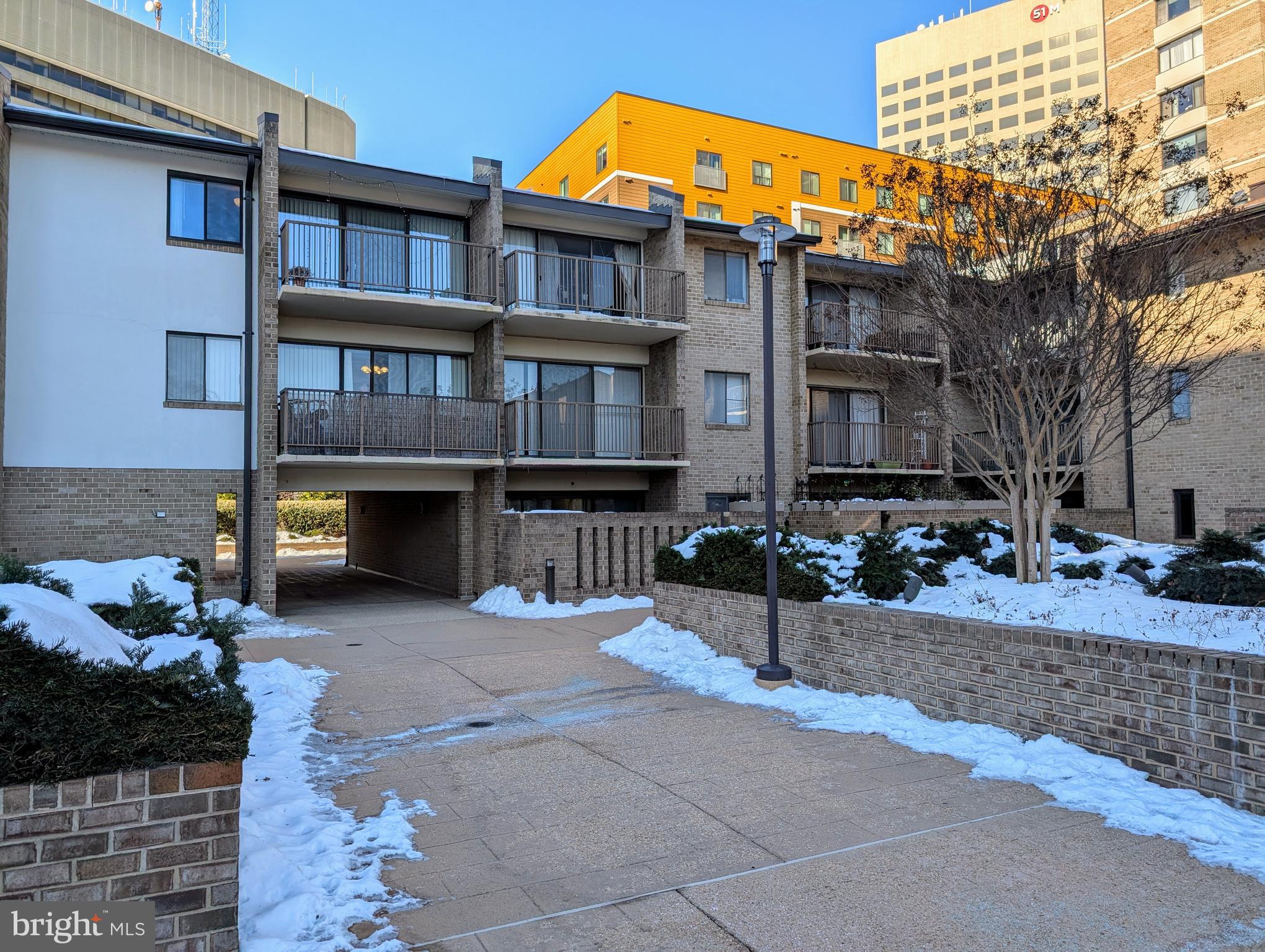 PRICE IMPROVEMENT – MOTIVATED SELLERS!
Discover 821 square feet of bright and airy living space in this spacious impeccably-maintained one-bedroom, one-bath condo, ideally located in downtown Rockville. This home boasts gleaming hardwood floors throughout, a private east-facing balcony, and a rare in-unit washer and dryer for added convenience. Dedicated garage parking makes city living stress-free.
ABUNDANT NATURAL LIGHT & BEAUTIFUL VIEWS
Enjoy gorgeous morning sunlight streaming through the large sliding glass doors that open to your private balcony. From here, admire the peaceful courtyard and the American flag at Veterans Park, just outside the community. On the west side of the condo, you’ll find a serene view of Monroe Park, a beautifully maintained city park with lush landscaping year-round. Open the west-facing window for a refreshing cross breeze that fills your home with fresh air.
WALK TO METRO – PERFECT FOR COMMUTERS!
Live in an ultra-convenient, walkable neighborhood! The Rockville Metro Station and Marc Train Systems are just 0.2 miles away, giving you an effortless commute. With quick access to I-270, shopping, dining, and entertainment, everything you need is just steps from your door.
PRISTINE CONDITION - MOVE-IN READY!
This home has been lovingly cared for and meticulously maintained, offering a clean, well-kept space that’s ready for its next owner.
ALL-INCLUSIVE AMENITIES & 24/7 CONCIERGE SERVICE
Your monthly condo fee covers all utilities—electricity, water, gas, trash and snow removal, daily cleaning of common areas, and professional landscaping. This well-maintained, gated community offers top-tier amenities, including:
- A 24-hour concierge who receives all packages
- A refreshing outdoor pool
- An updated gym
- A reservable community room for private events
- A sauna for relaxation
- A small private storage room
- Beautifully maintained grounds
COZY KITCHEN WITH POTENTIAL
The charming, light-filled kitchen features open shelving for easy access and organization, with plenty of potential for modern updates to make it your own.
A rare find with all utilities included—schedule your private tour today!