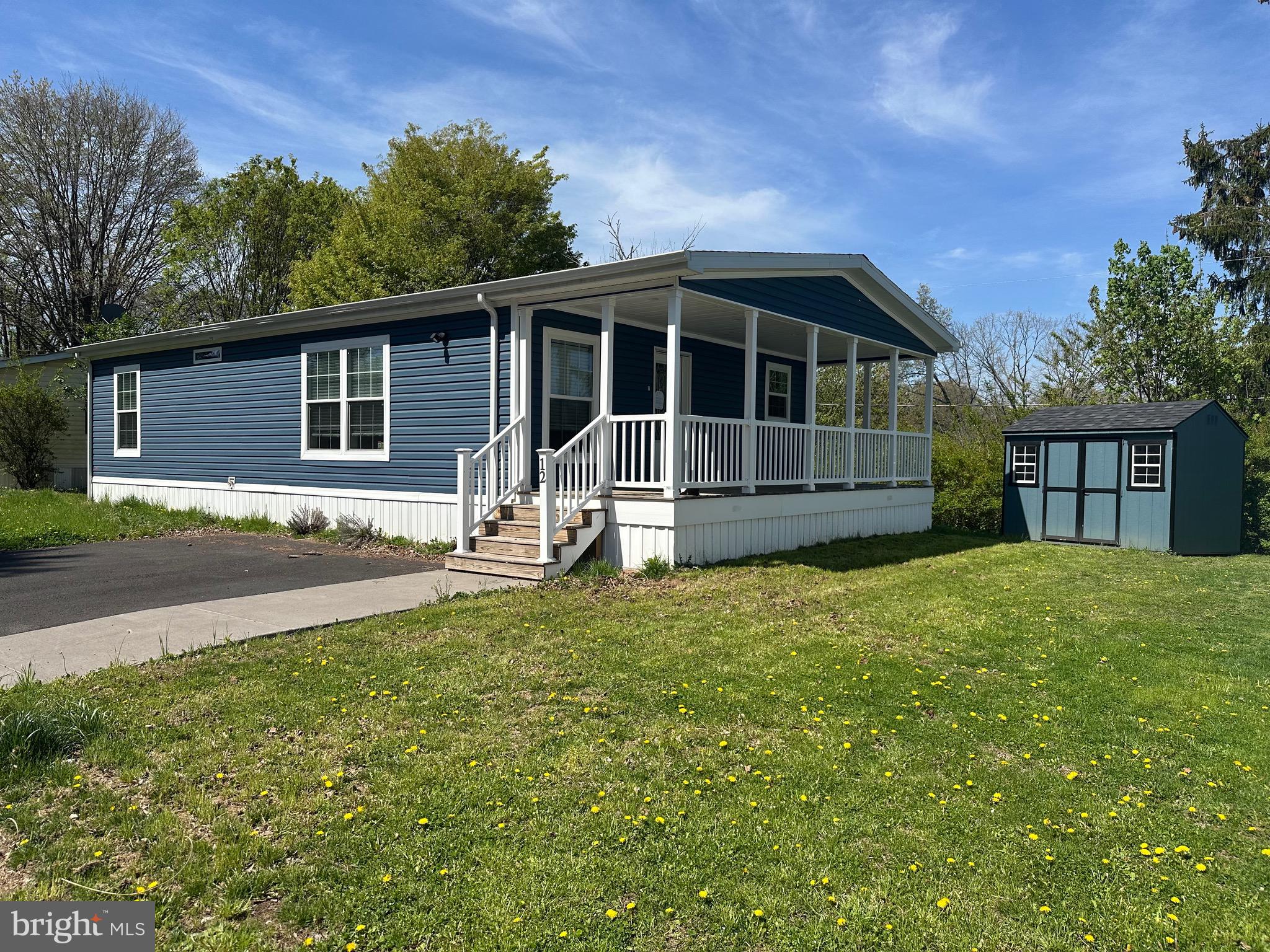 Cozy , comfortable living begins at this covered porch and continues into the open concept living area of this low maintenance home. The 2 bedrooms and 2 baths complete this like new unit. Along with the pool, mini golf and chip and putt, there is a walking/bike trail adjacent to the park. Residency approval required