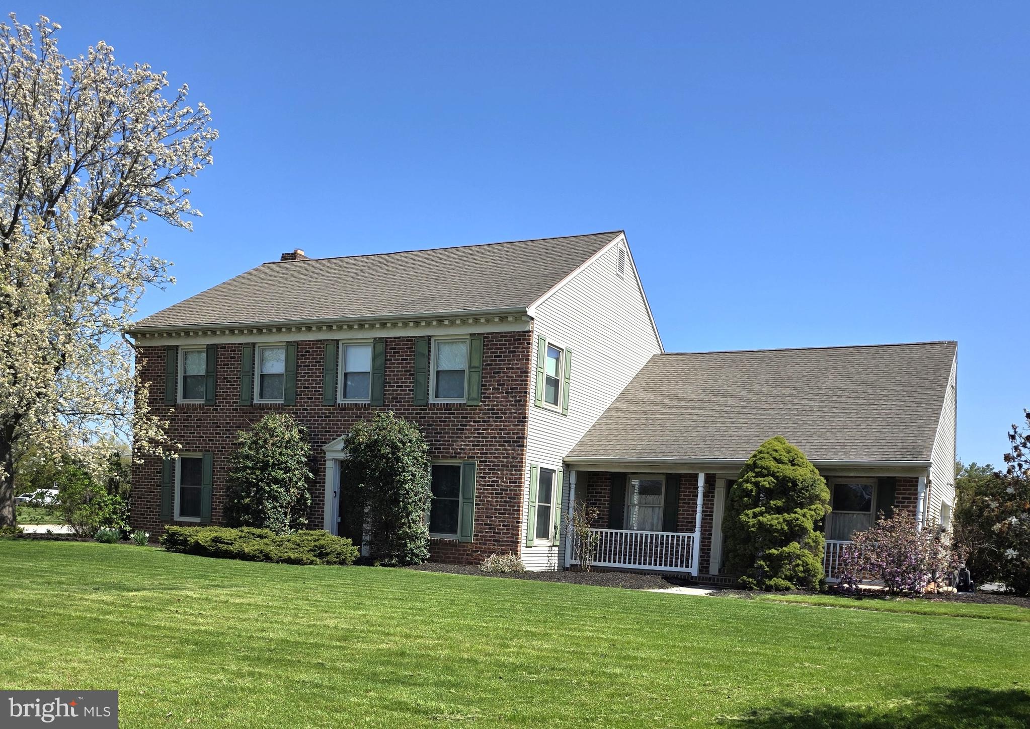 Looking for space, flexibility, and a backyard made for entertaining? This beautifully maintained one-owner home offers 4 bedrooms, 2 full and 2 half baths, a finished lower level, and an oversized garage—all set on a generous corner lot with a large front and side yard and a private, fenced pool area. Step inside to a versatile floor plan featuring a spacious living room or formal dining room to the left of the foyer, and a flexible office or additional sitting room to the right. The heart of the home is the inviting family room just off the kitchen, complete with a cozy wood-burning fireplace (easily convertible to gas) and direct access to the pool area—perfect for gatherings year-round. For those seeking a more open concept, the layout allows for enhanced flow between the main living spaces. The eat-in kitchen is designed with entertaining in mind, offering an island, Corian countertops, cherry cabinetry, included appliances, and sliding doors leading to the backyard oasis. Just beyond the kitchen, you’ll find a convenient powder room, laundry area, garage access, and a secondary entrance from the covered porch. Upstairs, the spacious primary suite features two closets and a private bath with a separate vanity area, soaking tub, and stand-up shower. Three additional bedrooms and a full hall bath complete the upper level. The finished lower level adds even more living space with a rec room, wet bar, half bath, and outside entrance to the pool and backyard.  Outdoors, enjoy your own private retreat with an in-ground, heated saltwater pool featuring Kona tile, a lanai-style bottom, and a diving board. The oversized garage also provides direct access to the pool area and includes pull-down attic storage, while the expansive driveway offers plenty of parking for guests. AGENTS: Please read agent remarks.